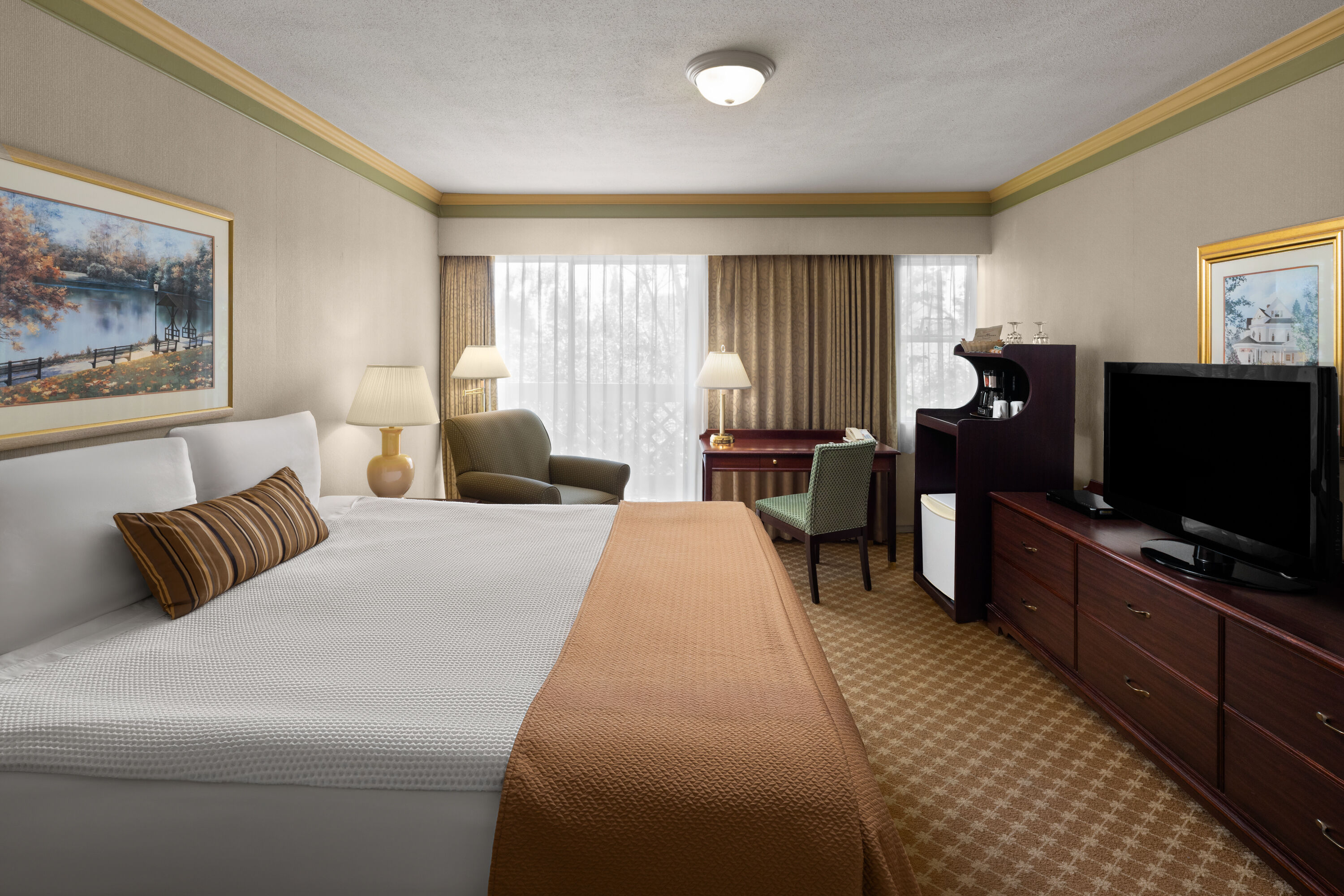 Guest room at the Royal Scot Hotel & Suites, Trademark Collection by Wyndham in Victoria, British Columbia