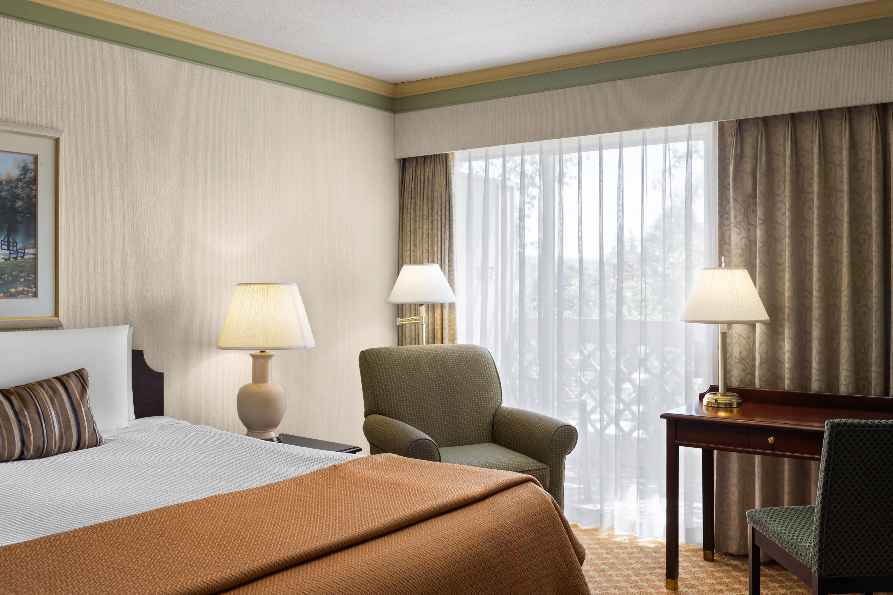 Guest room at the Royal Scot Hotel & Suites, Trademark Collection by Wyndham in Victoria, British Columbia