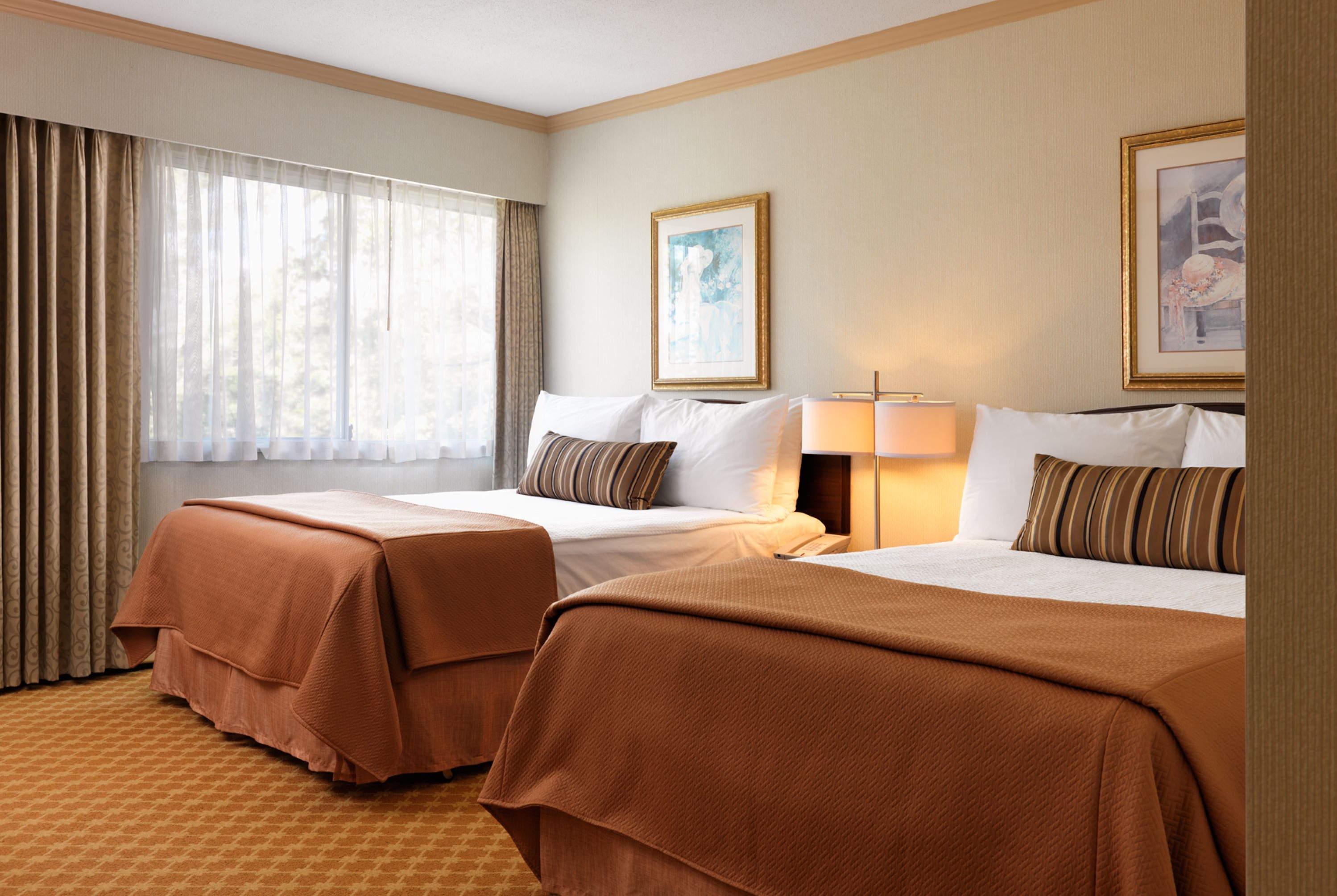 Guest room at the Royal Scot Hotel & Suites, Trademark Collection by Wyndham in Victoria, British Columbia