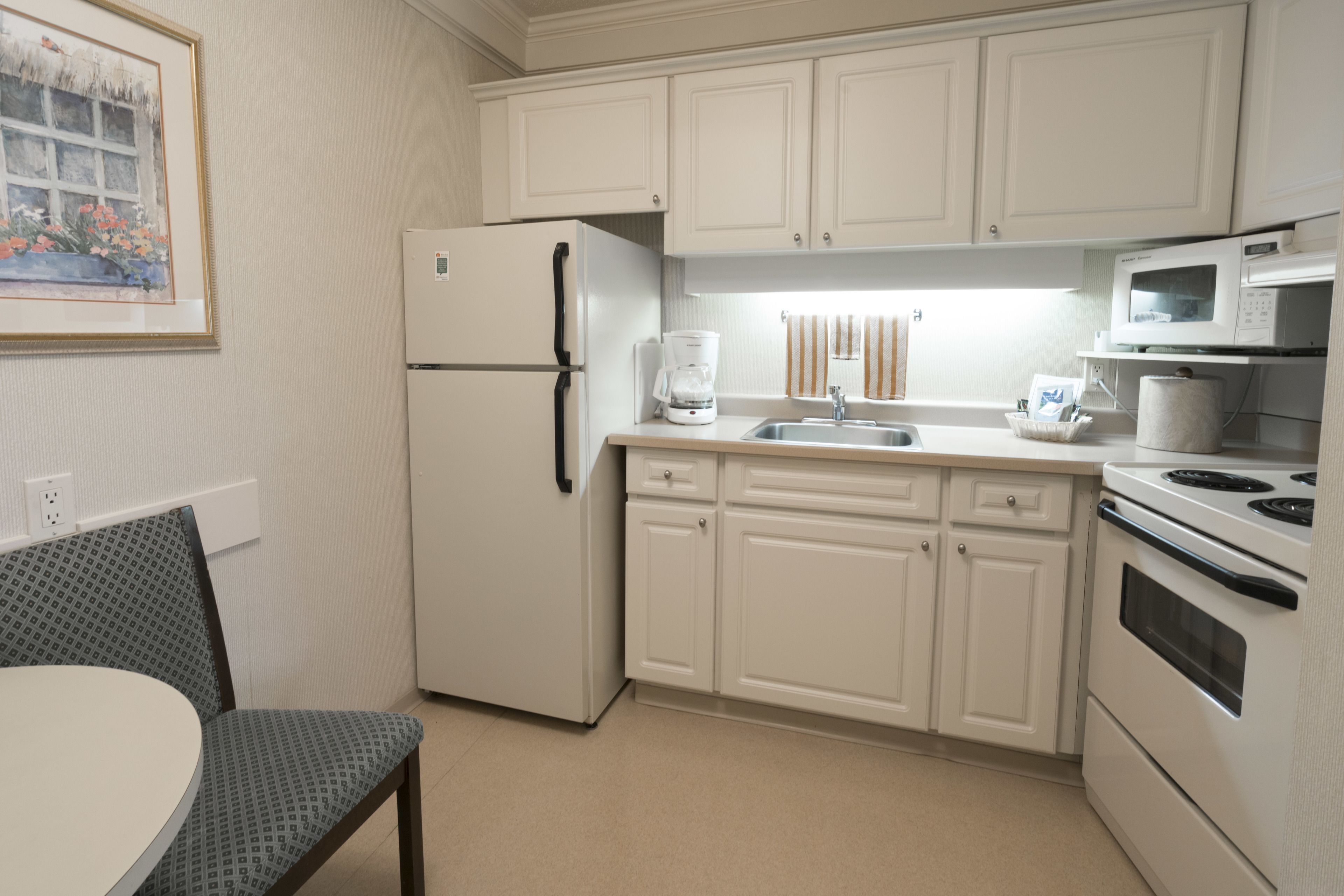 Guest room at the Royal Scot Hotel & Suites, Trademark Collection by Wyndham in Victoria, British Columbia