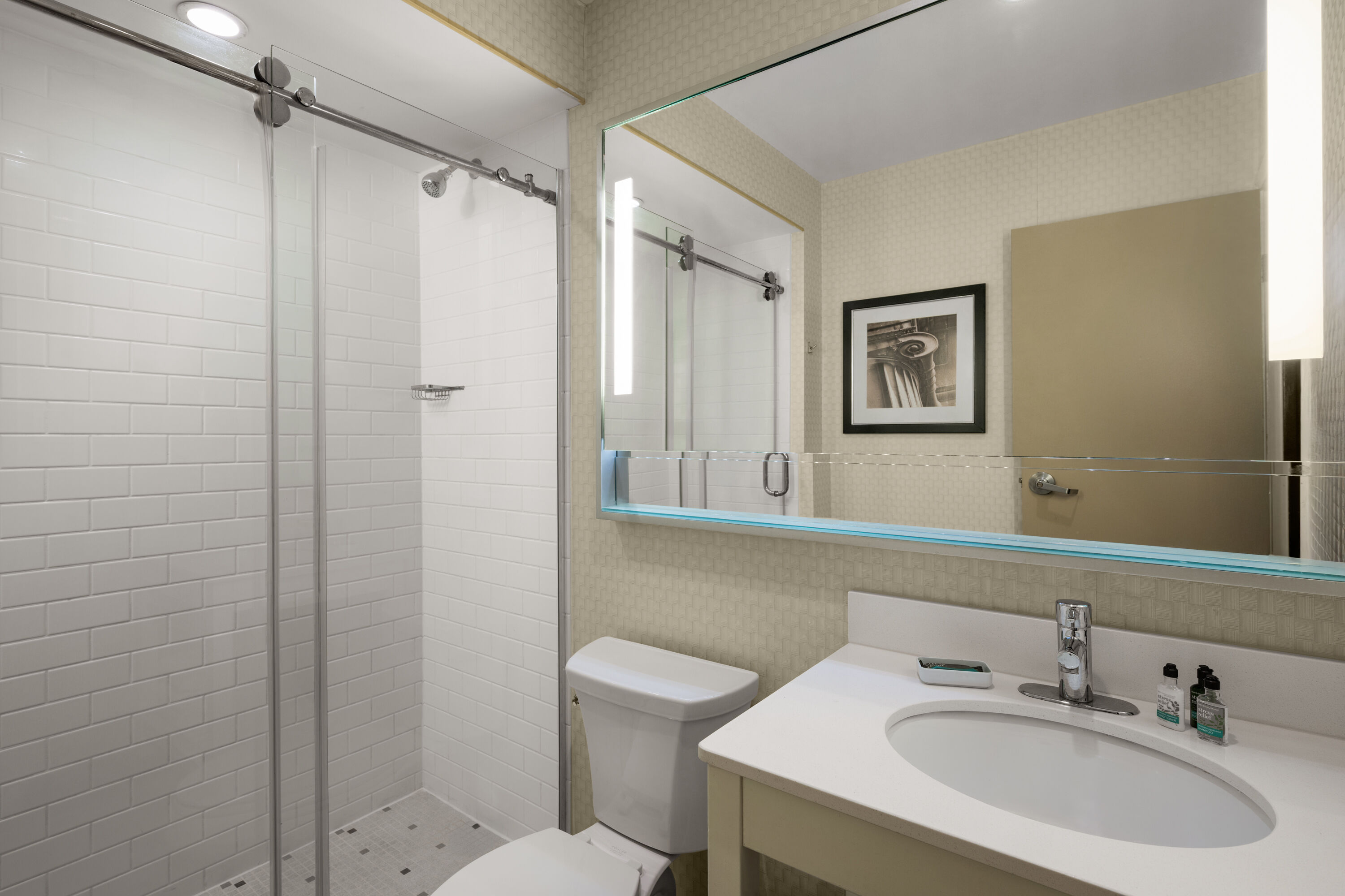 Guest room bath at the Waterloo Suites Hotel, Trademark Collection by Wyndham in Waterloo, Ontario
