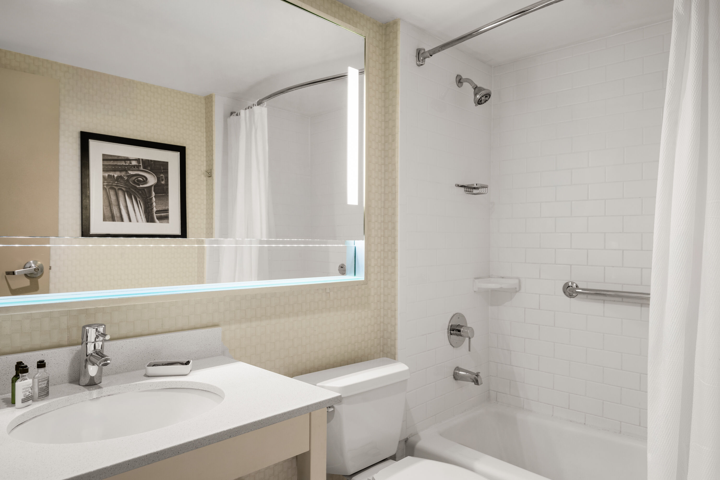 Guest room bath at the Waterloo Suites Hotel, Trademark Collection by Wyndham in Waterloo, Ontario