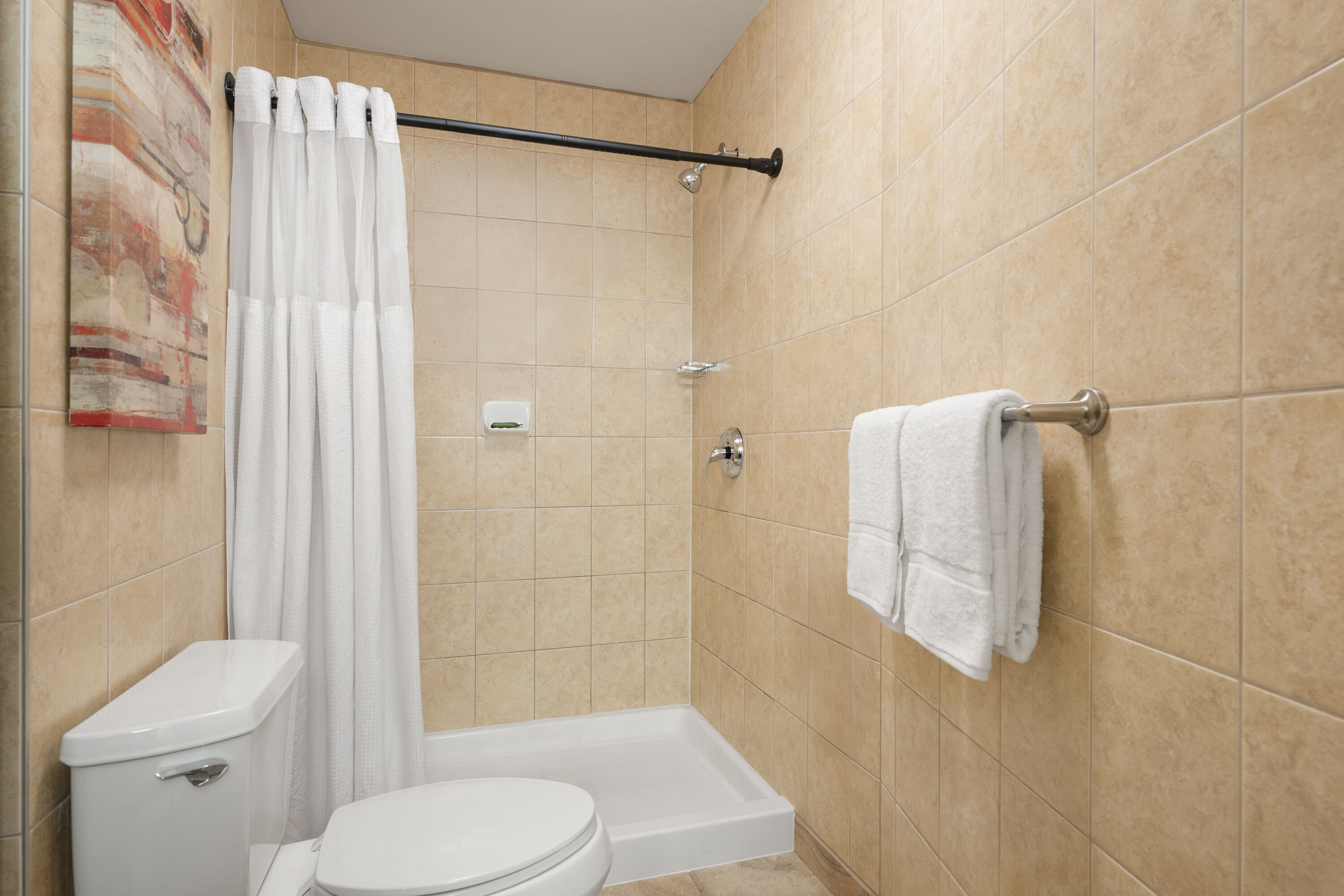 Guest room bath at the Waterloo Suites Hotel, Trademark Collection by Wyndham in Waterloo, Ontario