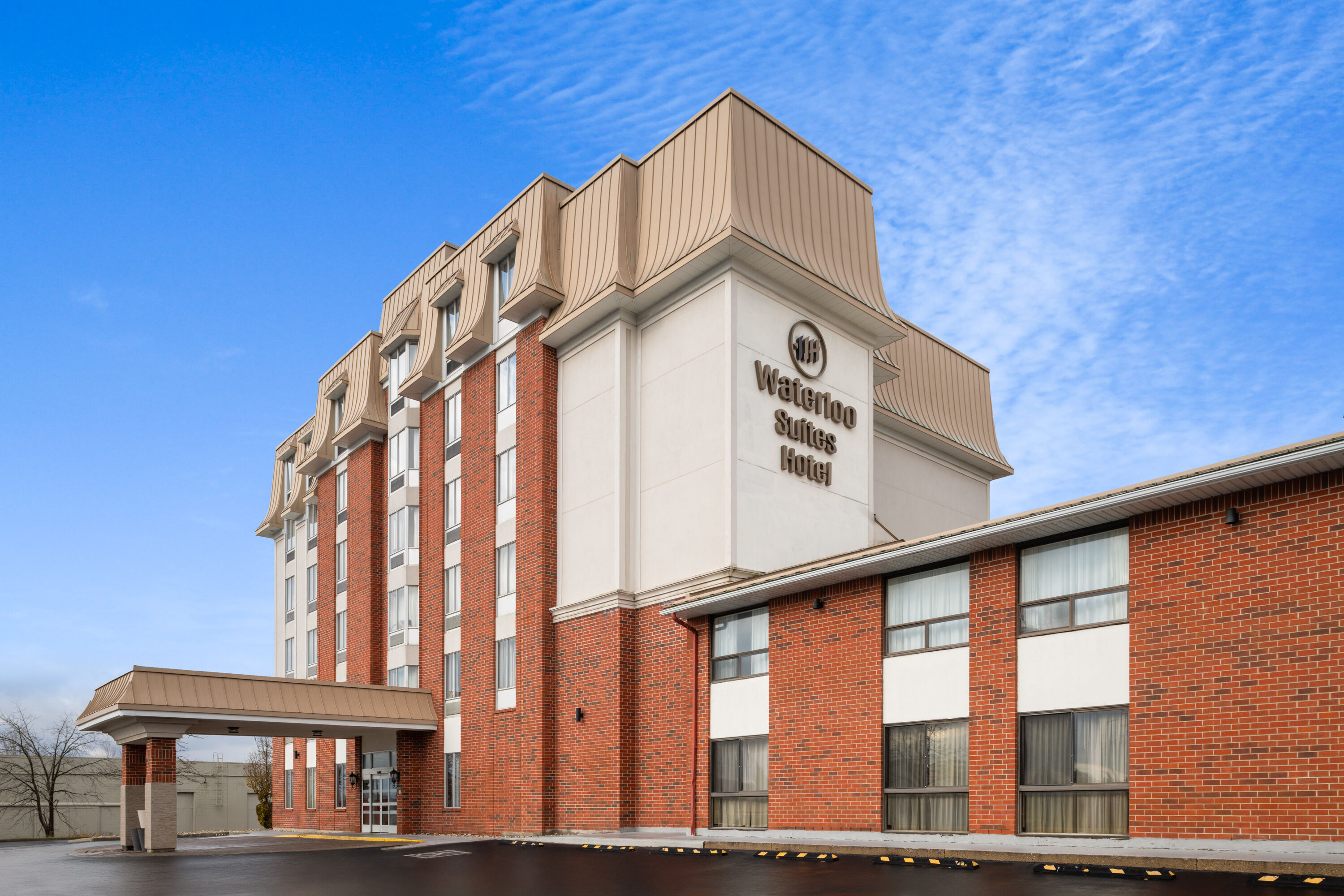 Exterior Day Image of Waterloo Suites Hotel, Trademark Collection by Wyndham hotel in Waterloo, Ontario