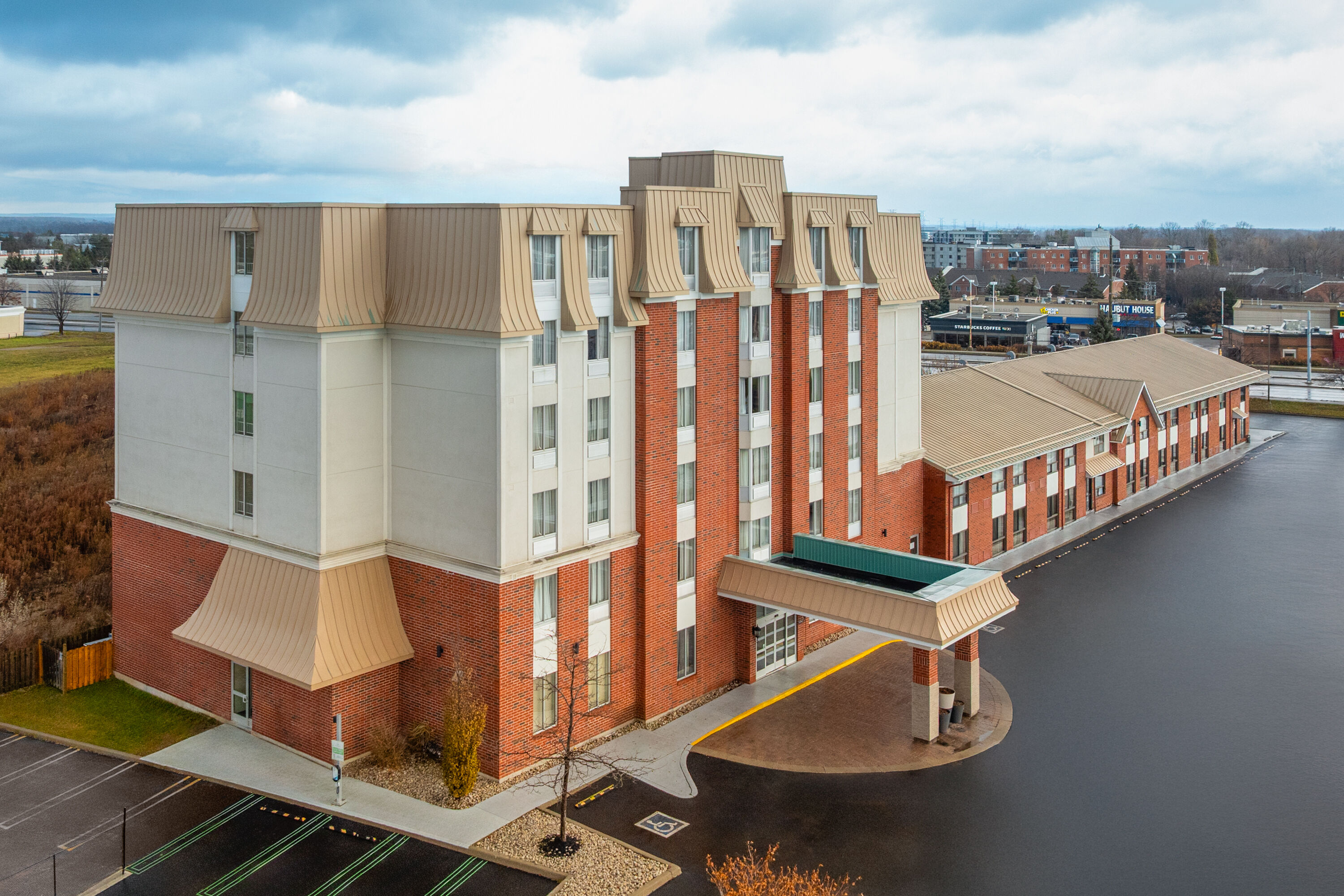 Exterior Day Image of Waterloo Suites Hotel, Trademark Collection by Wyndham hotel in Waterloo, Ontario