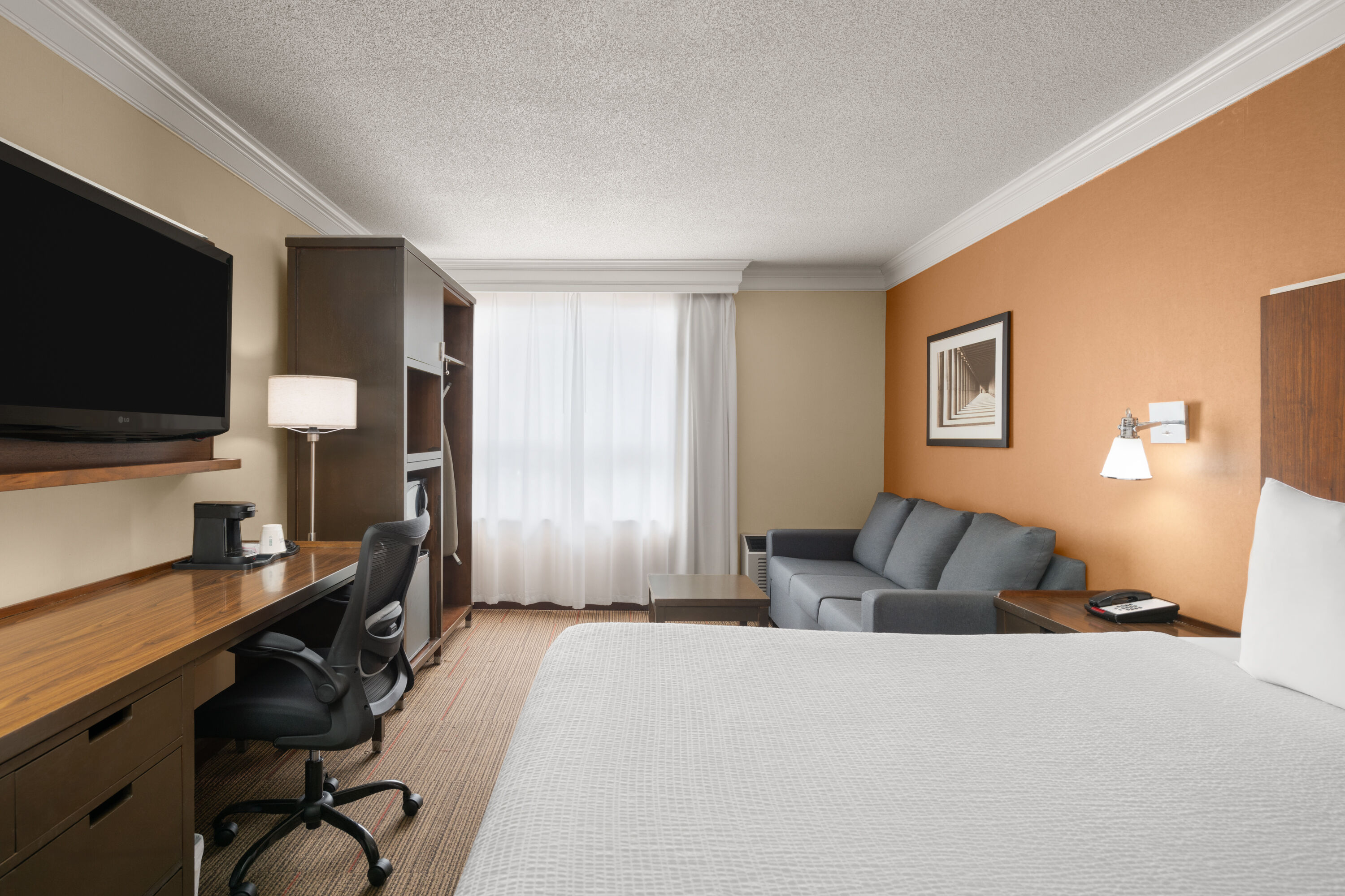 Guest room at the Waterloo Suites Hotel, Trademark Collection by Wyndham in Waterloo, Ontario