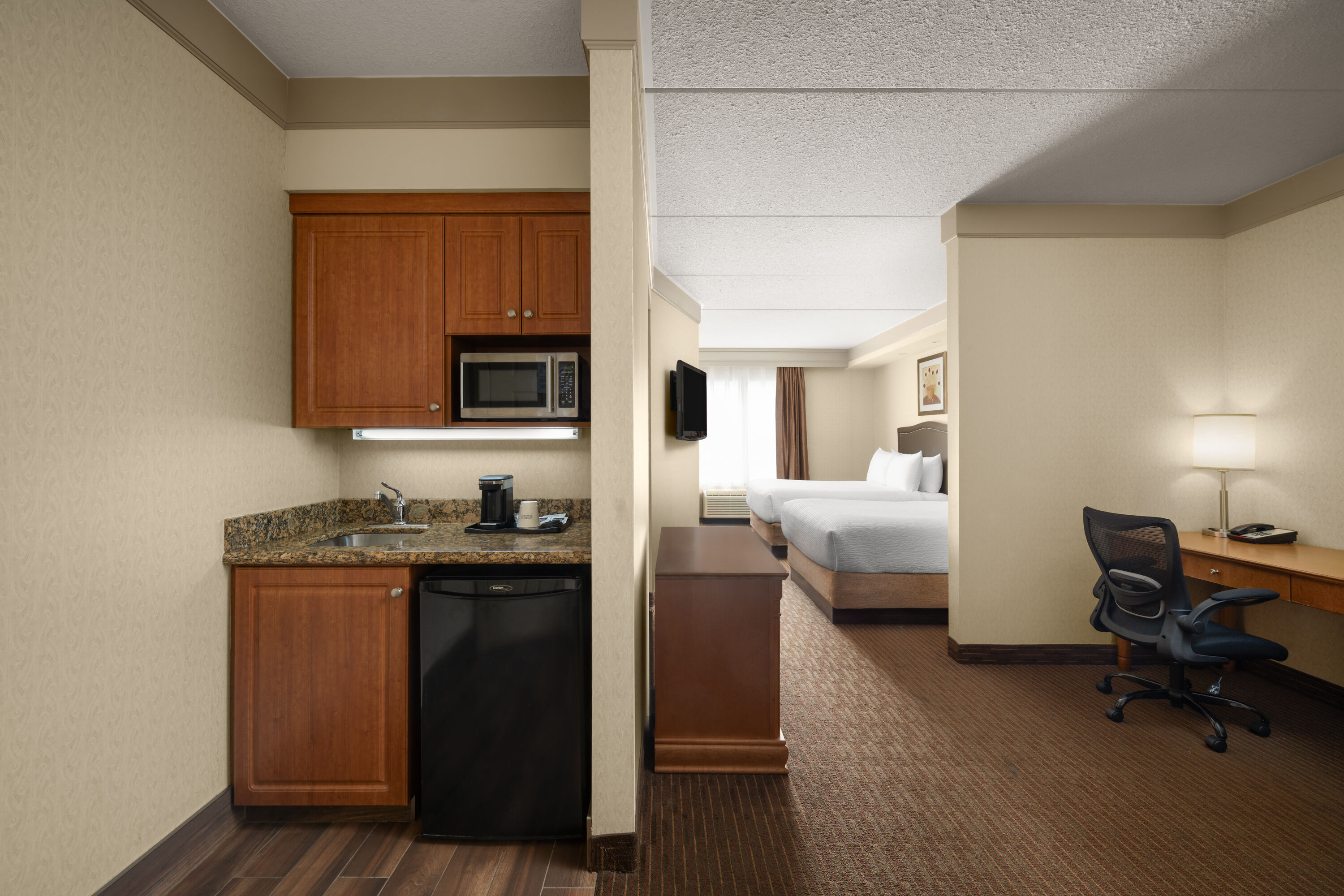 Guest room at the Waterloo Suites Hotel, Trademark Collection by Wyndham in Waterloo, Ontario