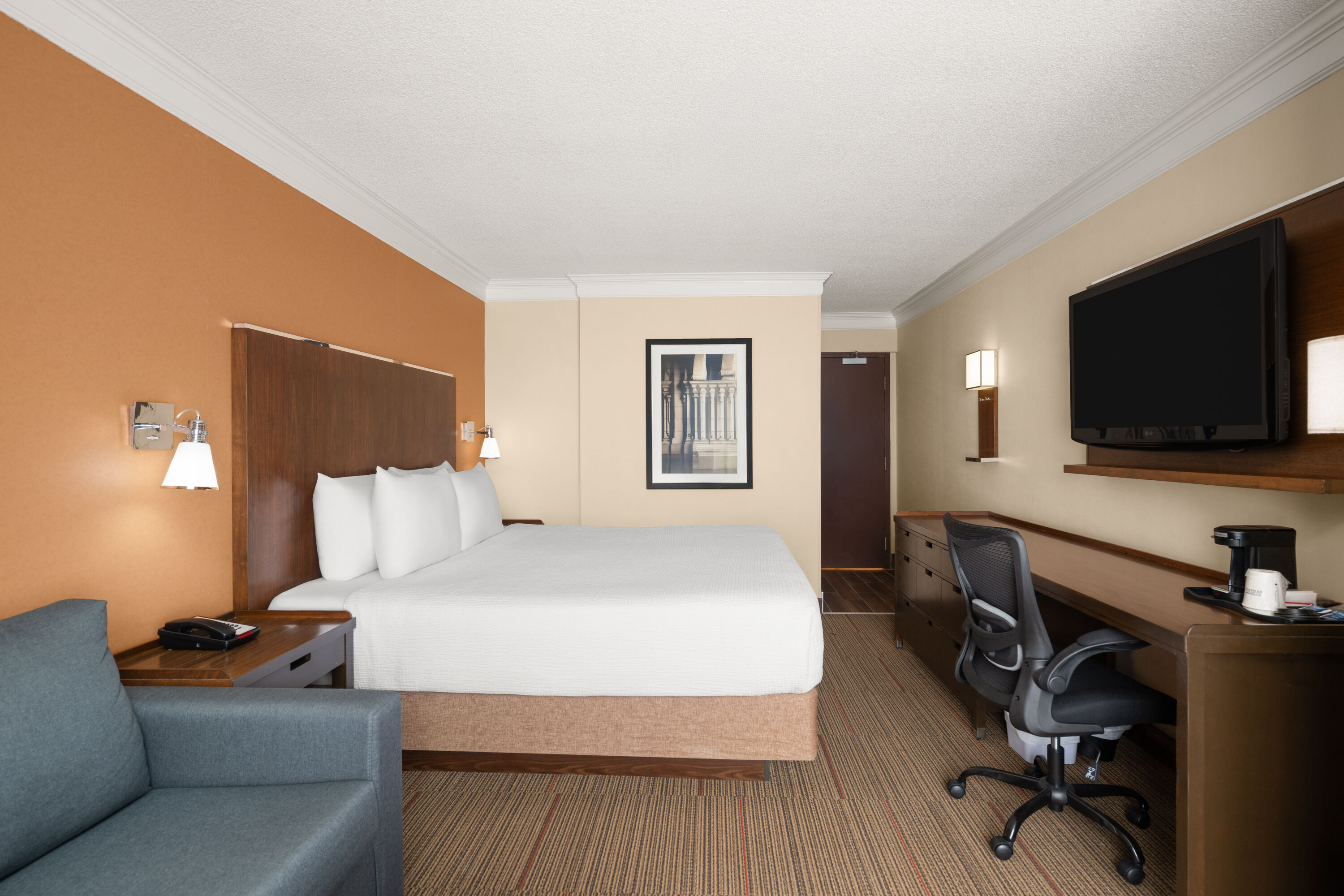 Guest room at the Waterloo Suites Hotel, Trademark Collection by Wyndham in Waterloo, Ontario