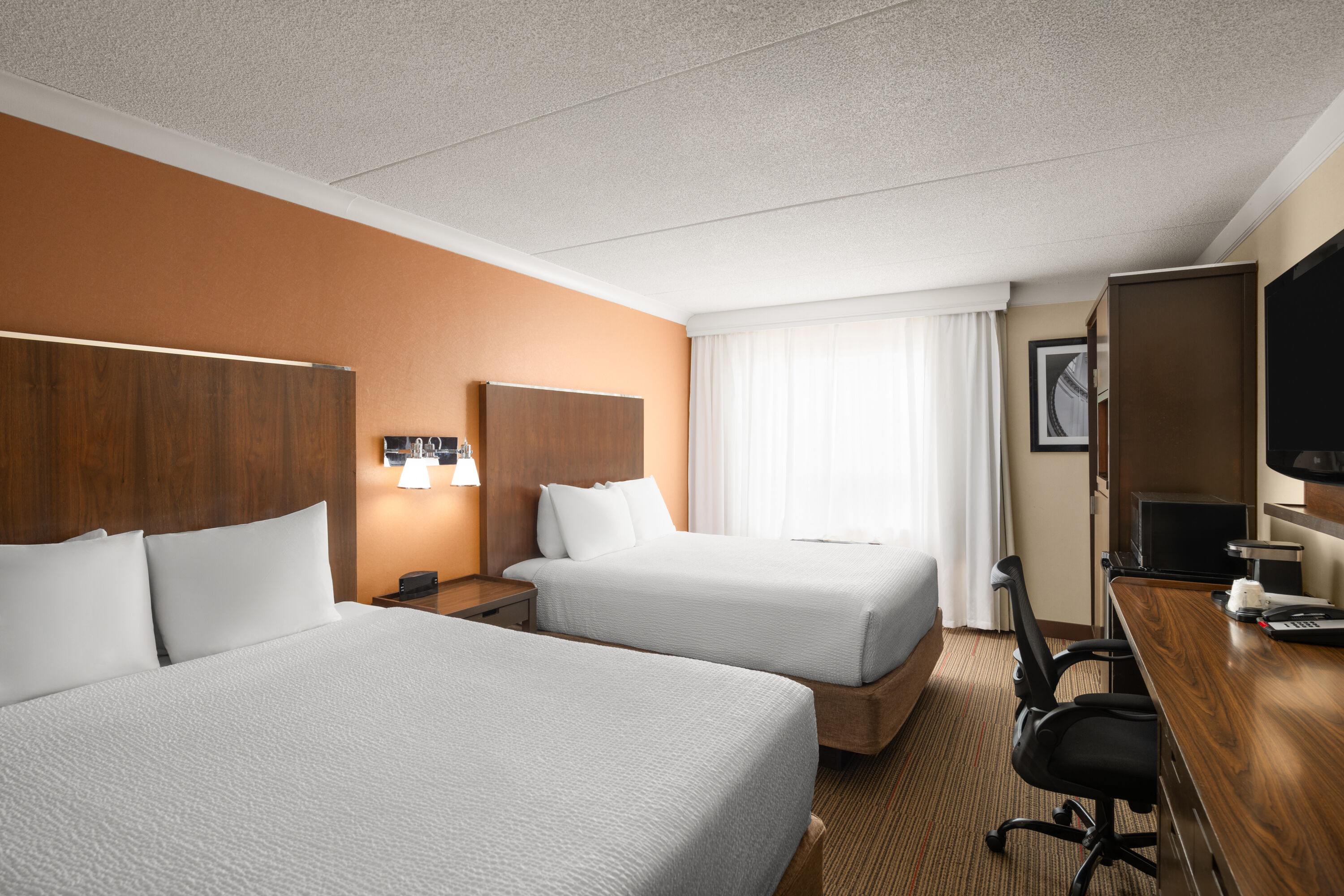 Guest room at the Waterloo Suites Hotel, Trademark Collection by Wyndham in Waterloo, Ontario
