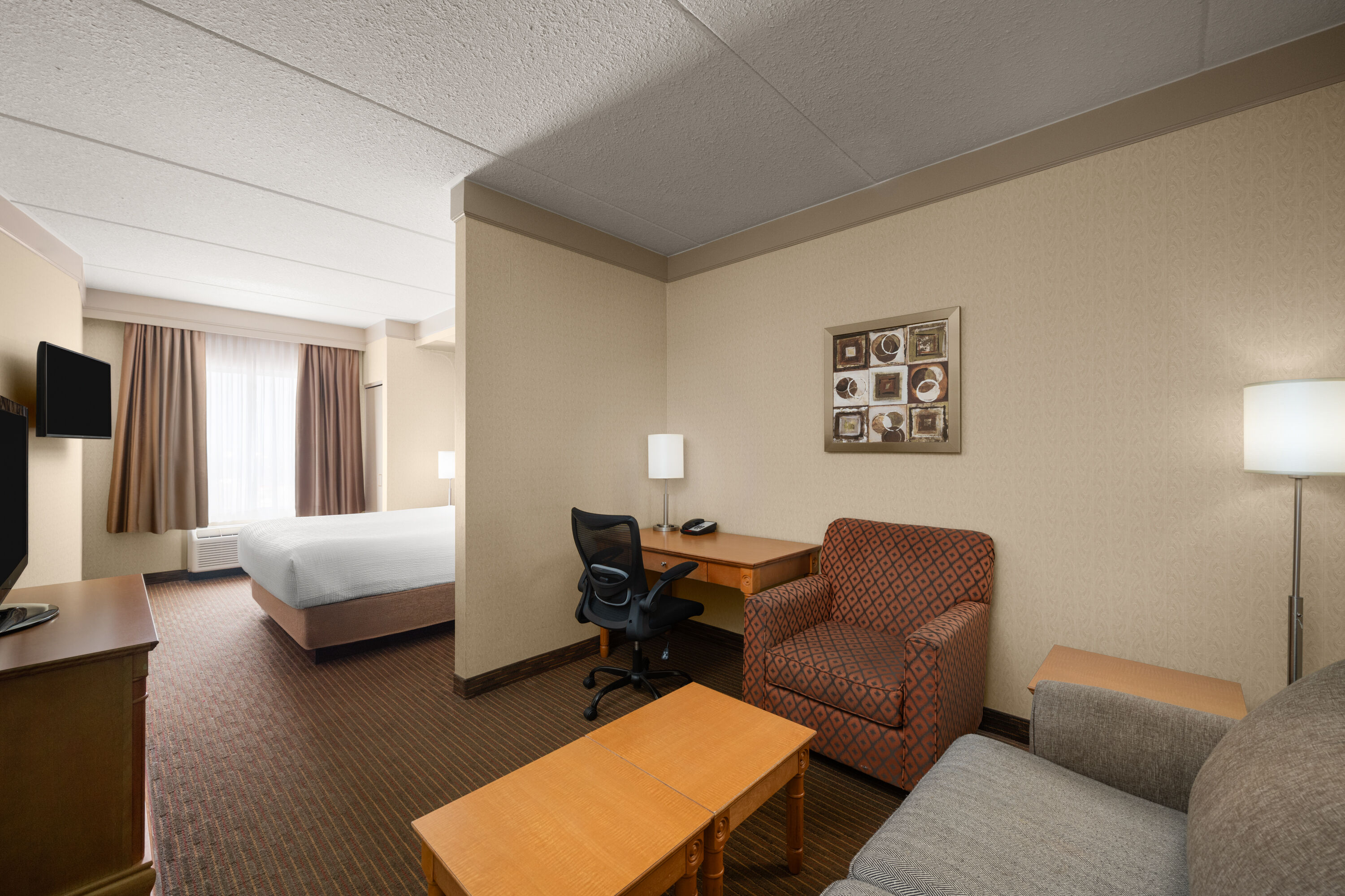 Guest room at the Waterloo Suites Hotel, Trademark Collection by Wyndham in Waterloo, Ontario