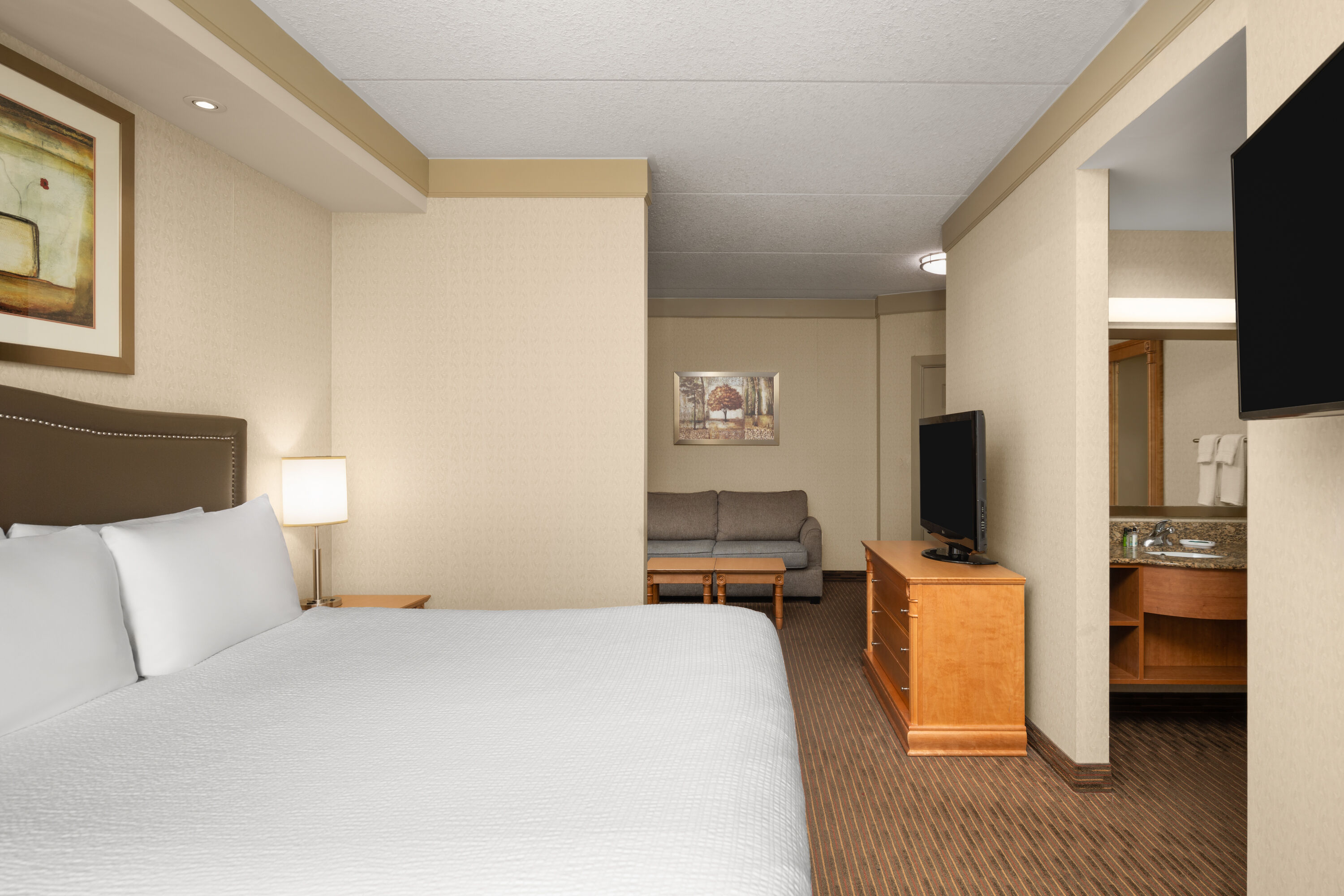 Guest room at the Waterloo Suites Hotel, Trademark Collection by Wyndham in Waterloo, Ontario