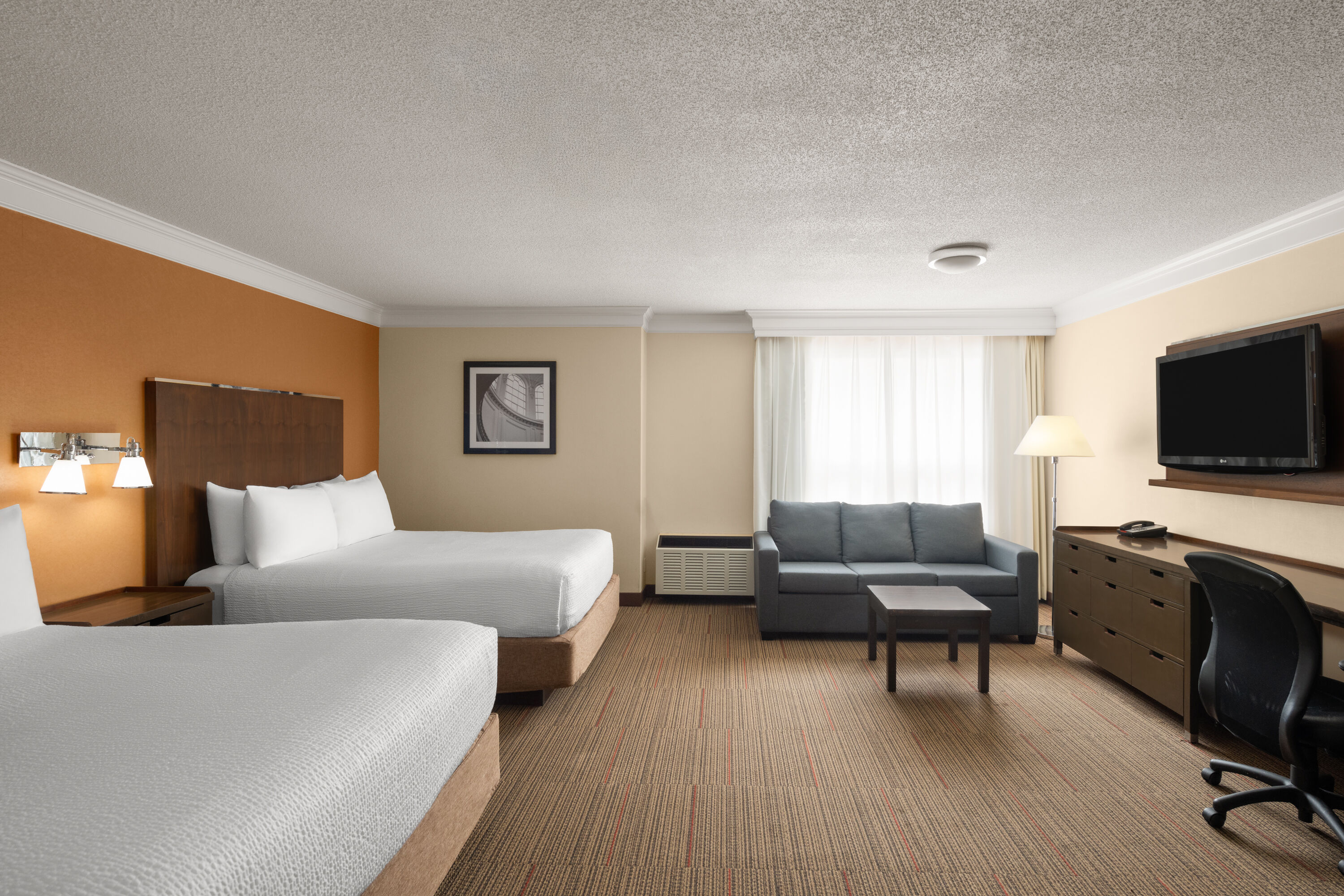 Guest room at the Waterloo Suites Hotel, Trademark Collection by Wyndham in Waterloo, Ontario