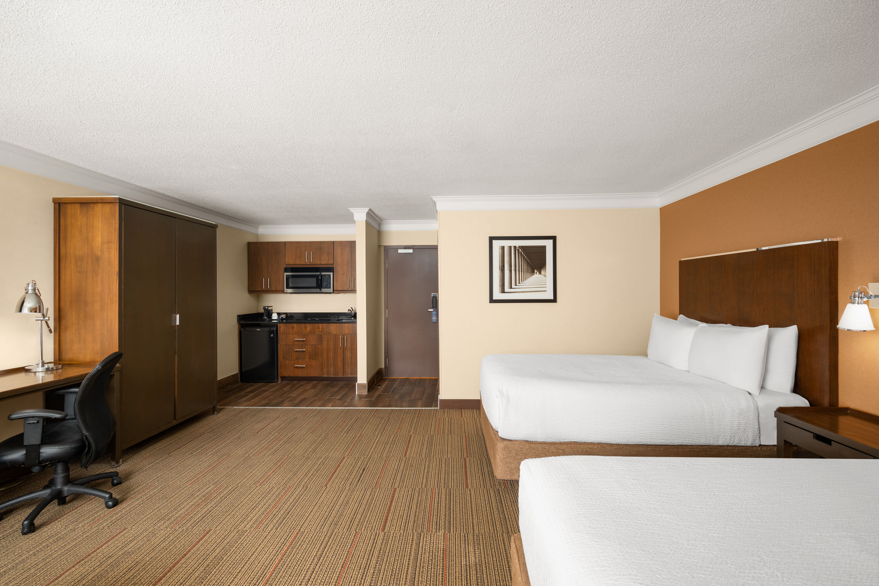 Guest room at the Waterloo Suites Hotel, Trademark Collection by Wyndham in Waterloo, Ontario