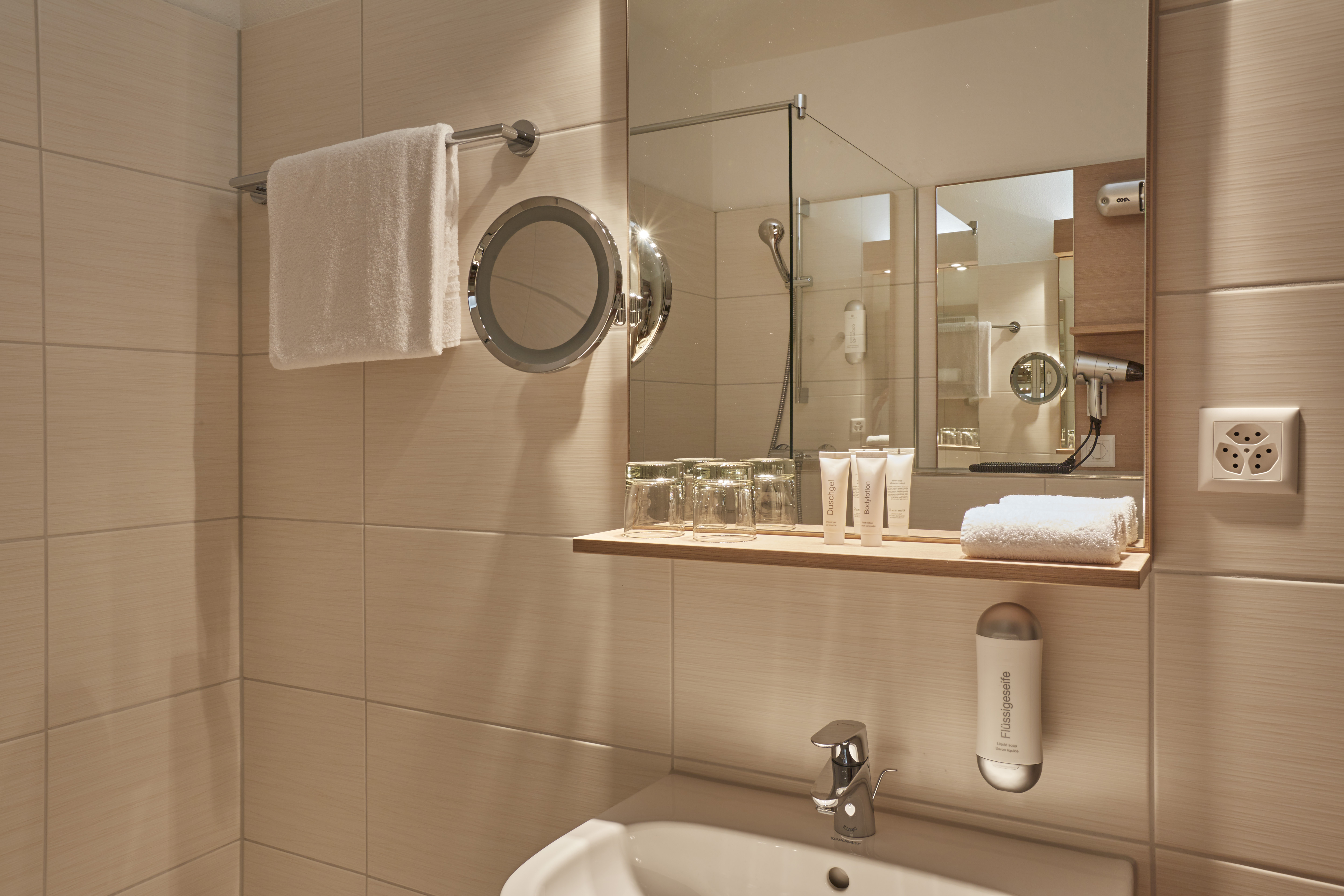 Guest room bath at the H4 Hotel Arcadia Locarno in Locarno, Other than US/Canada