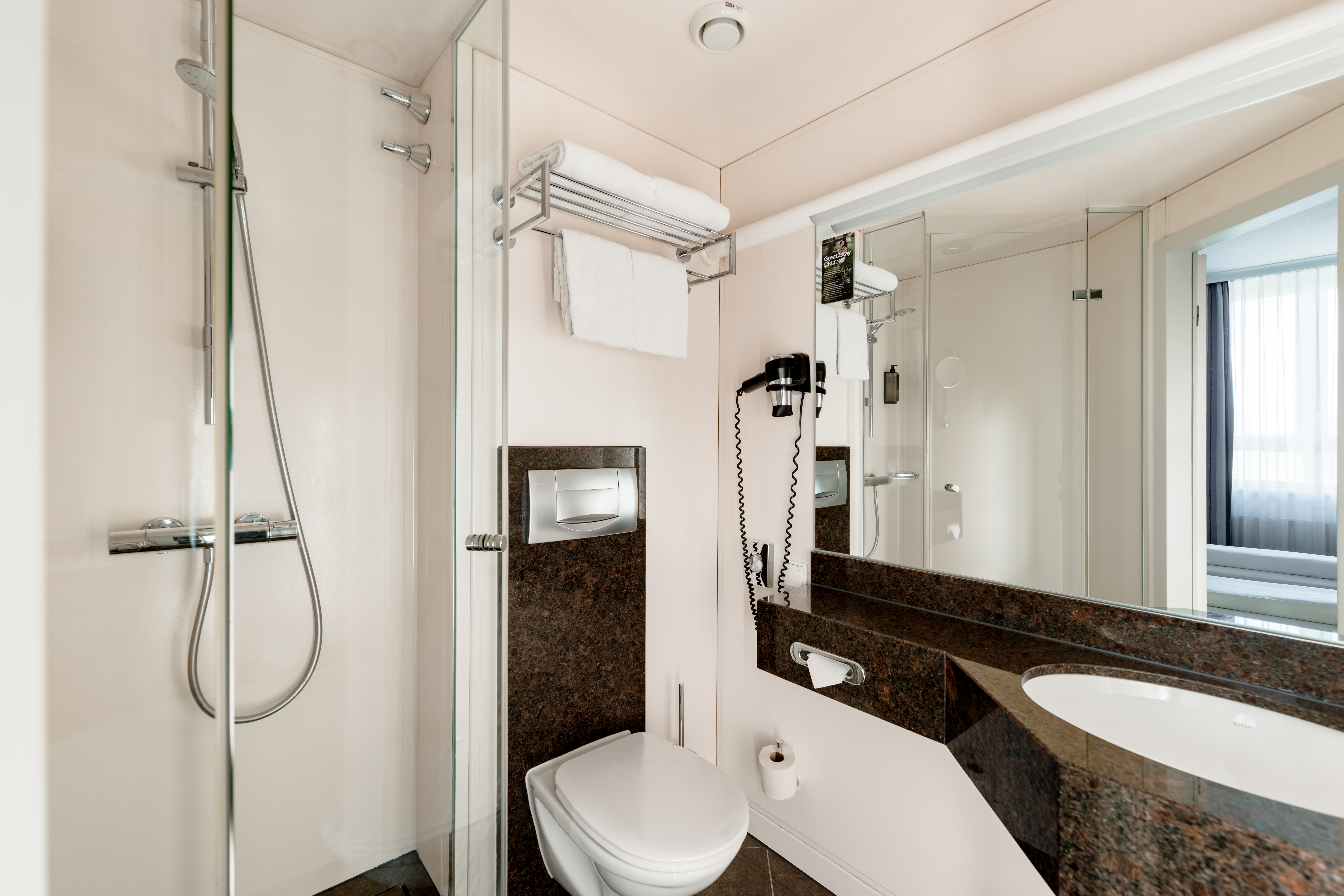 Guest room bath at the Rugs Hotel Augsburg, Trademark Collection by Wyndham in Augsburg, Other than US/Canada