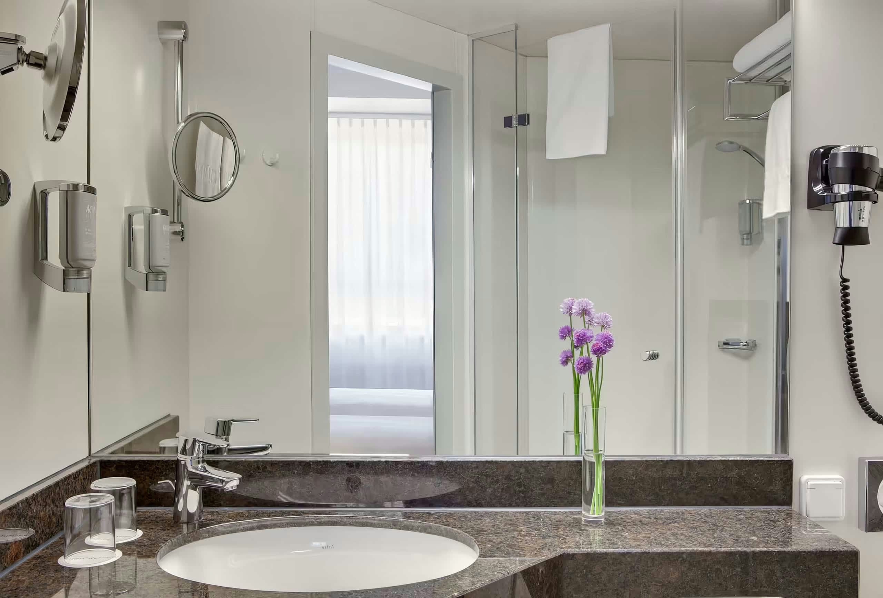 Guest room bath at the Rugs Hotel Augsburg, Trademark Collection by Wyndham in Augsburg, Other than US/Canada