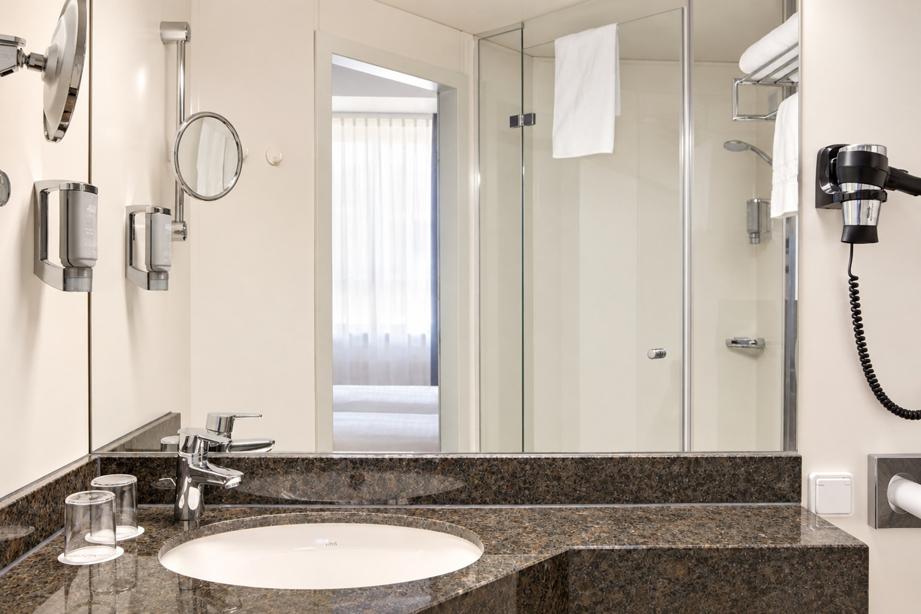 Guest room bath at the Rugs Hotel Augsburg, Trademark Collection by Wyndham in Augsburg, Other than US/Canada