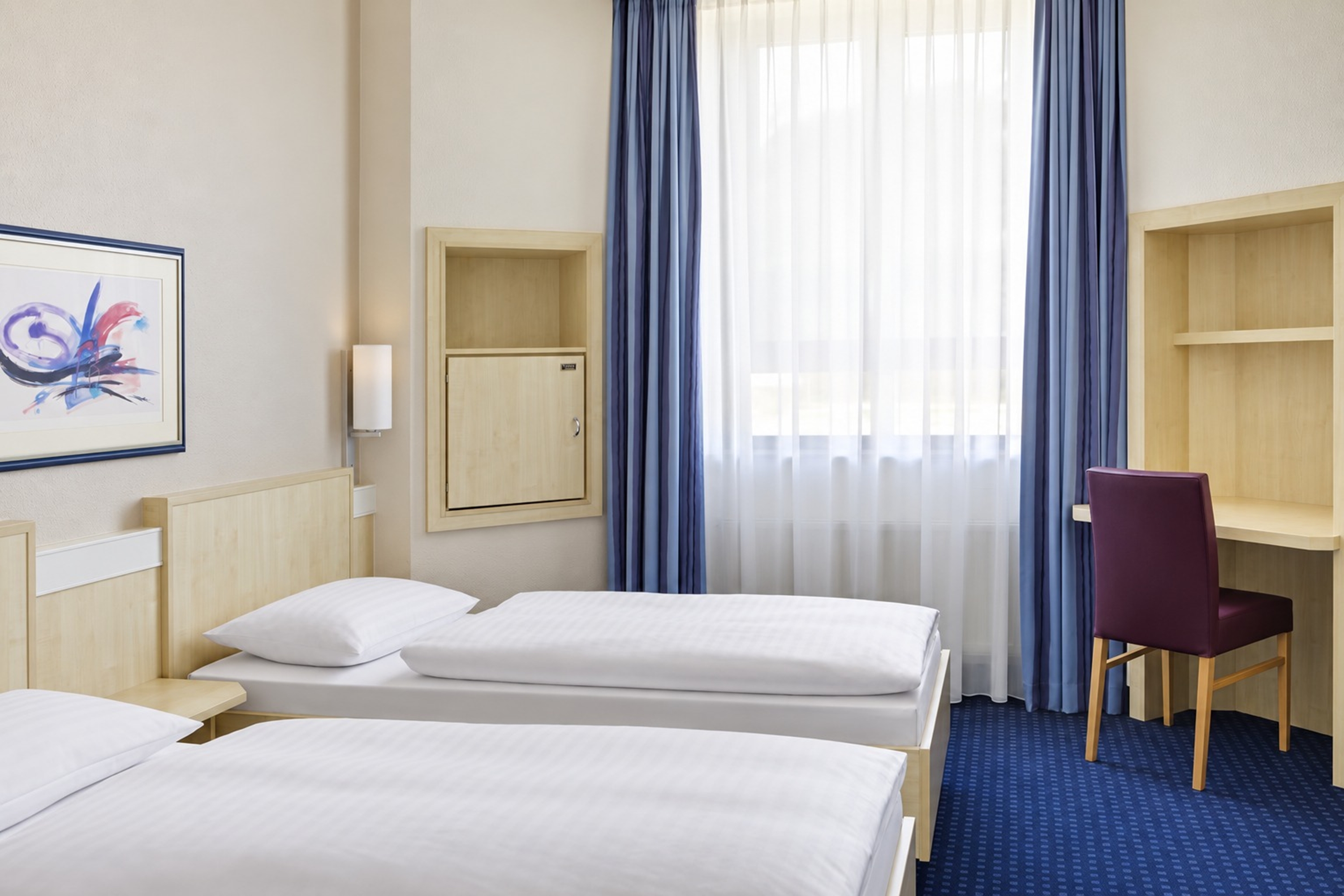 Guest room at the Rugs Hotel Augsburg, Trademark Collection by Wyndham in Augsburg, Other than US/Canada