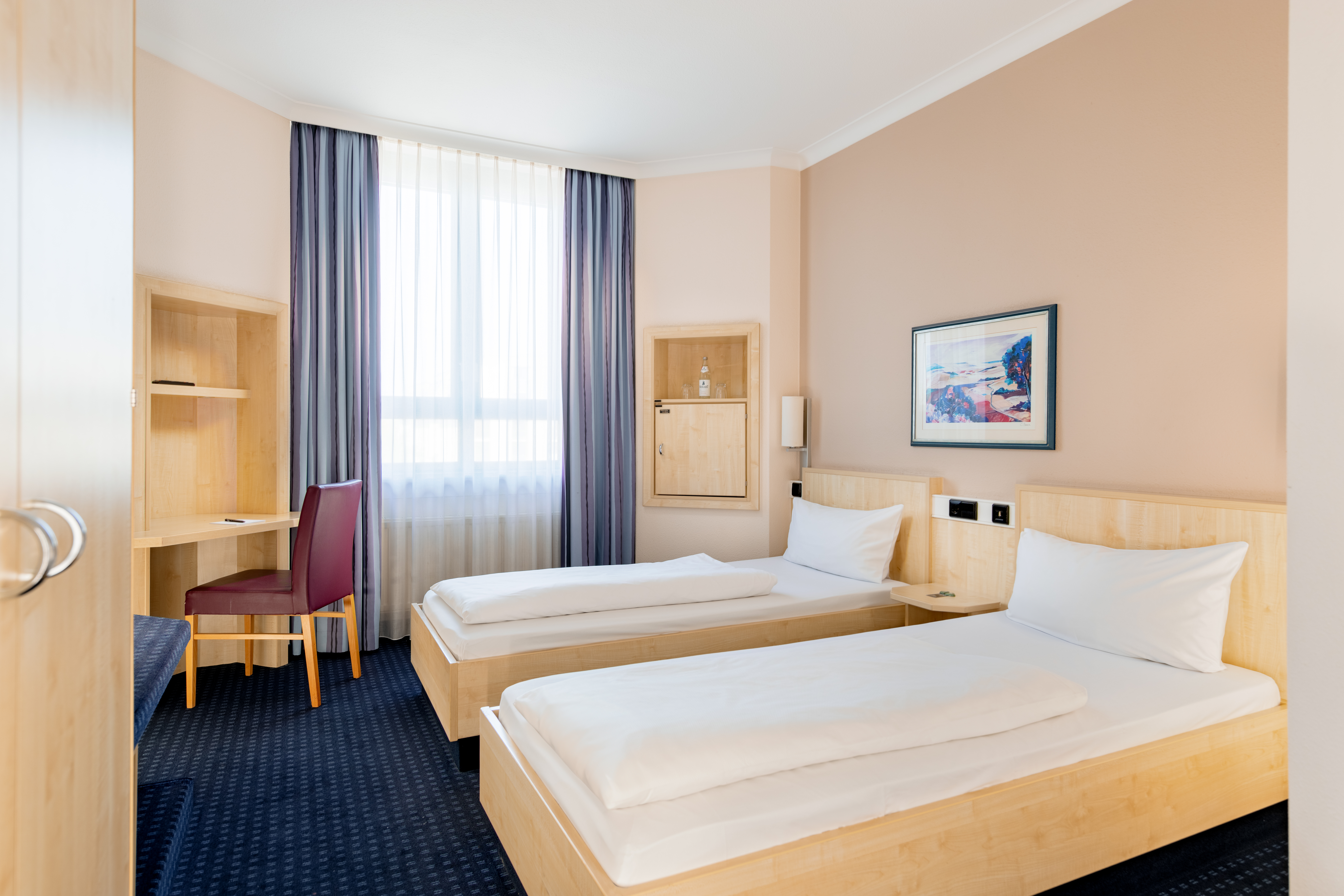 Guest room at the Rugs Hotel Augsburg, Trademark Collection by Wyndham in Augsburg, Other than US/Canada