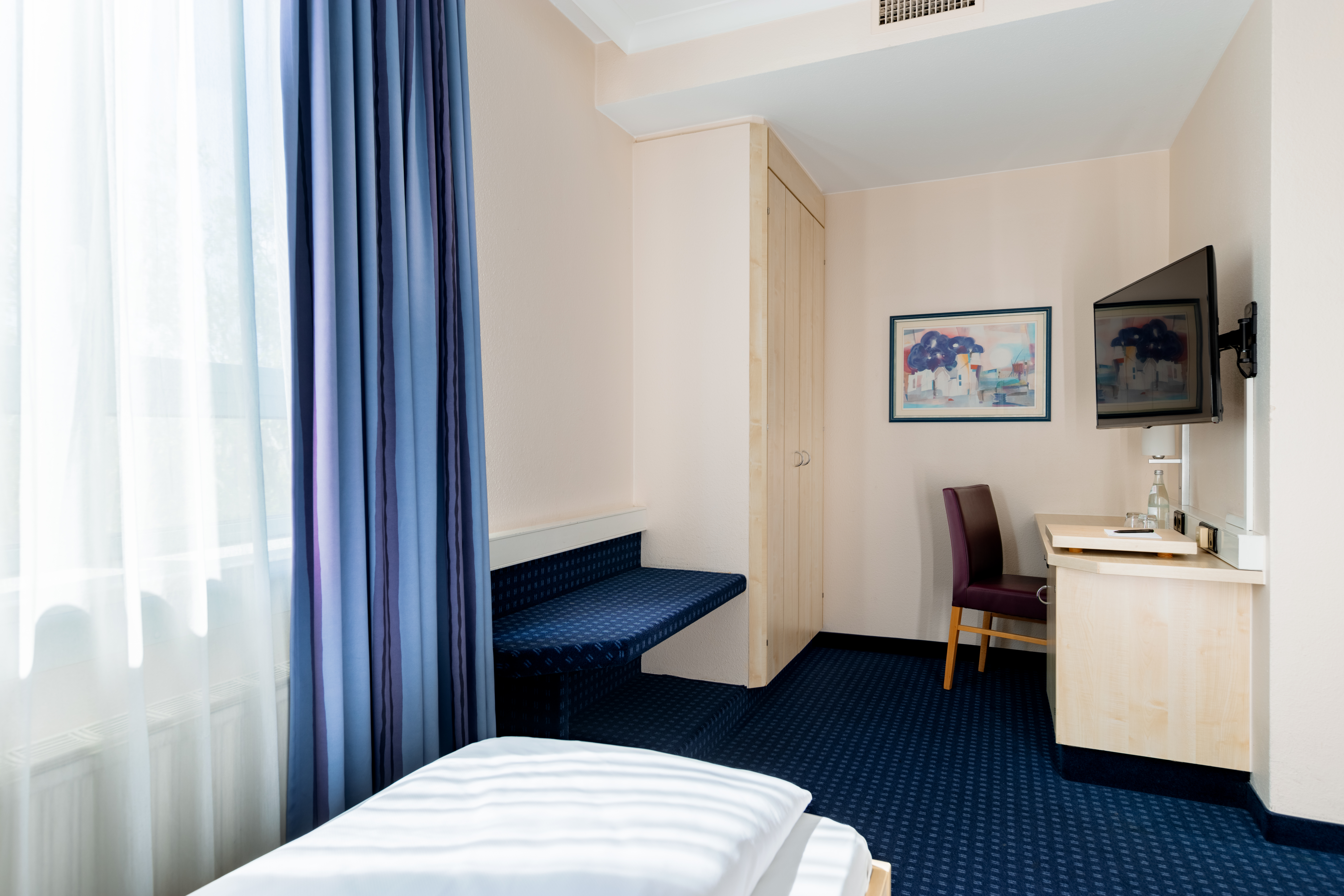 Guest room at the Rugs Hotel Augsburg, Trademark Collection by Wyndham in Augsburg, Other than US/Canada