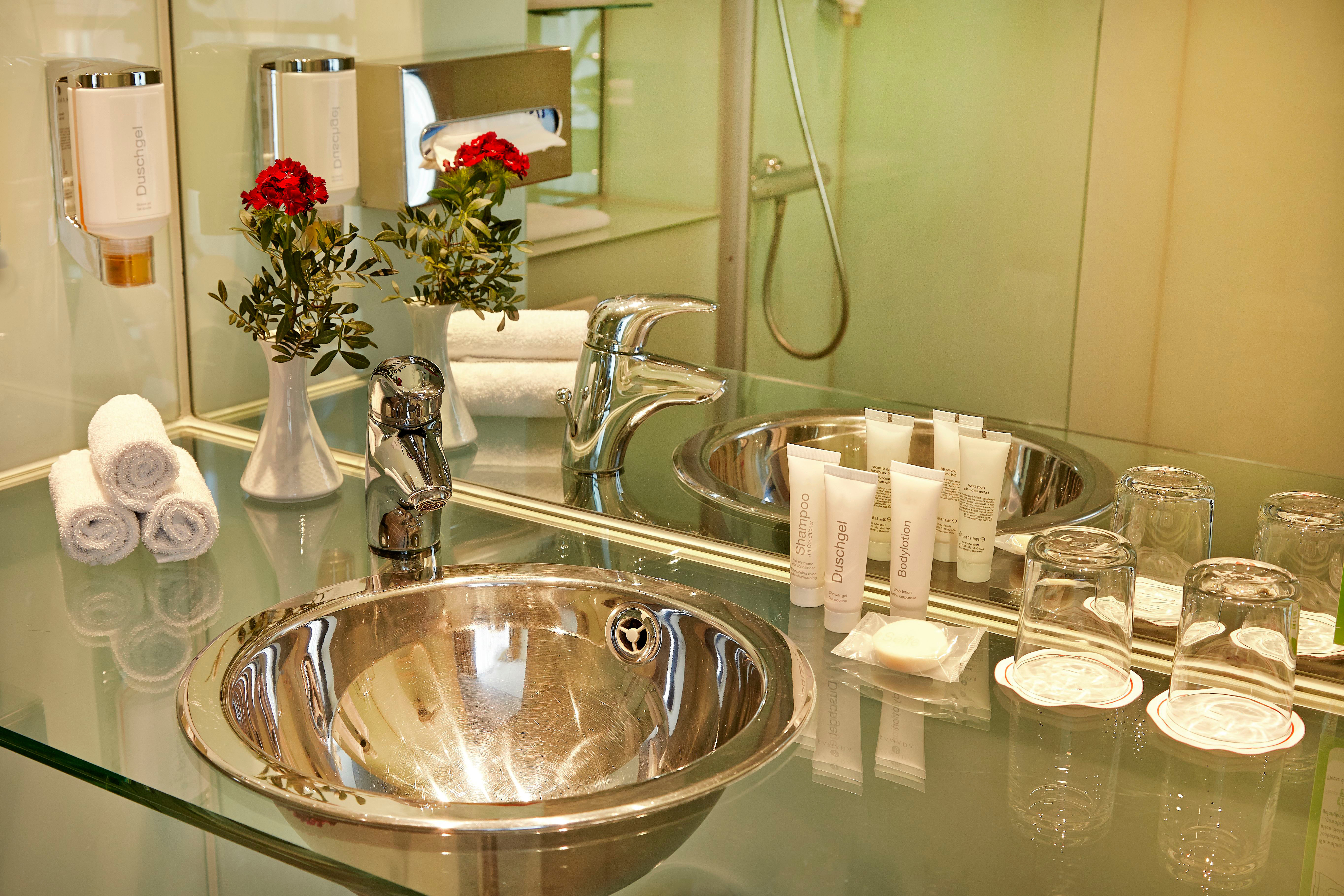 Guest room bath at the H+ Hotel Berlin Mitte in Berlin, Other than US/Canada