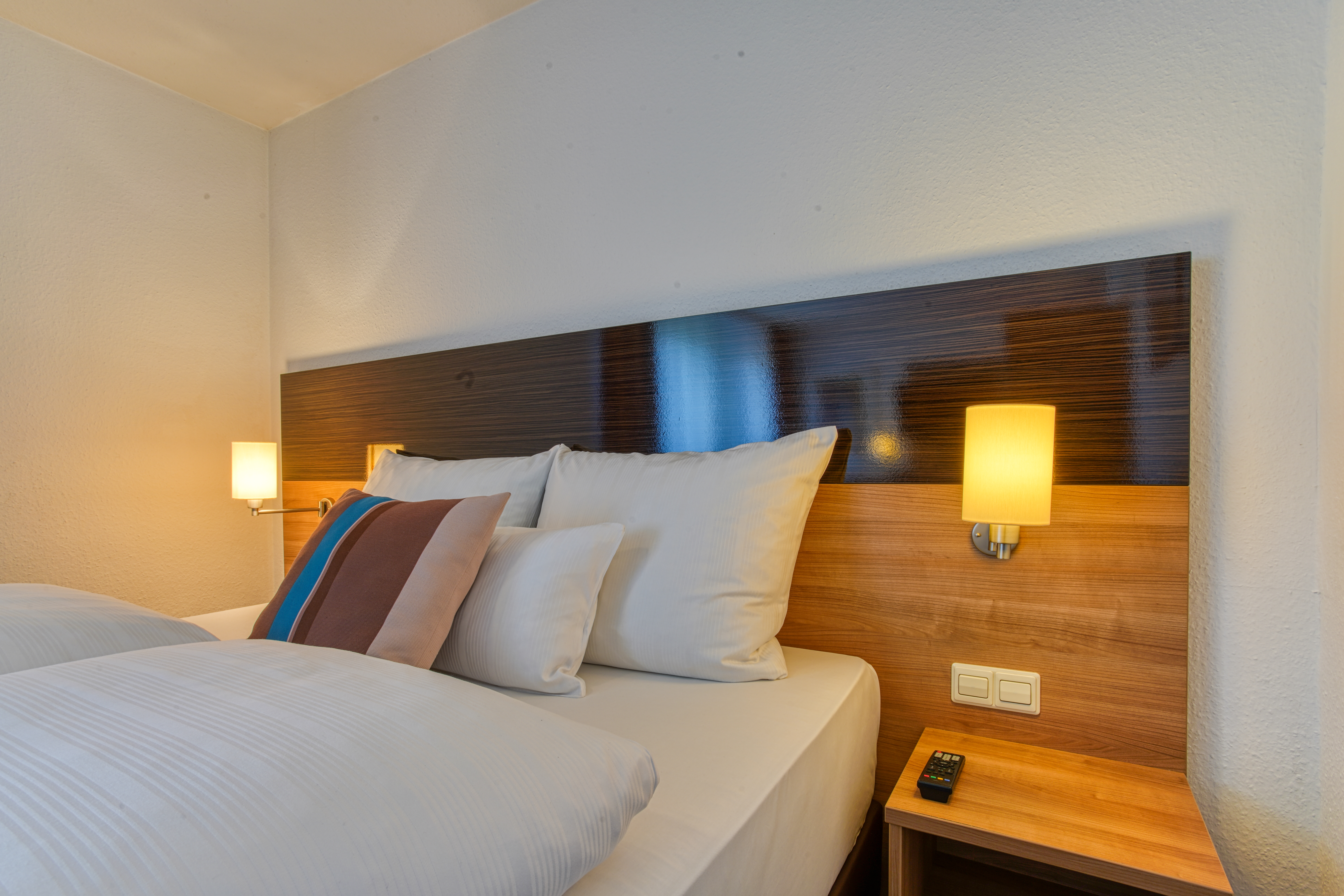Guest room at the Centro Hotel U-NO1, Trademark Collection by Wyndham in Grossbettlingen, Other than US/Canada