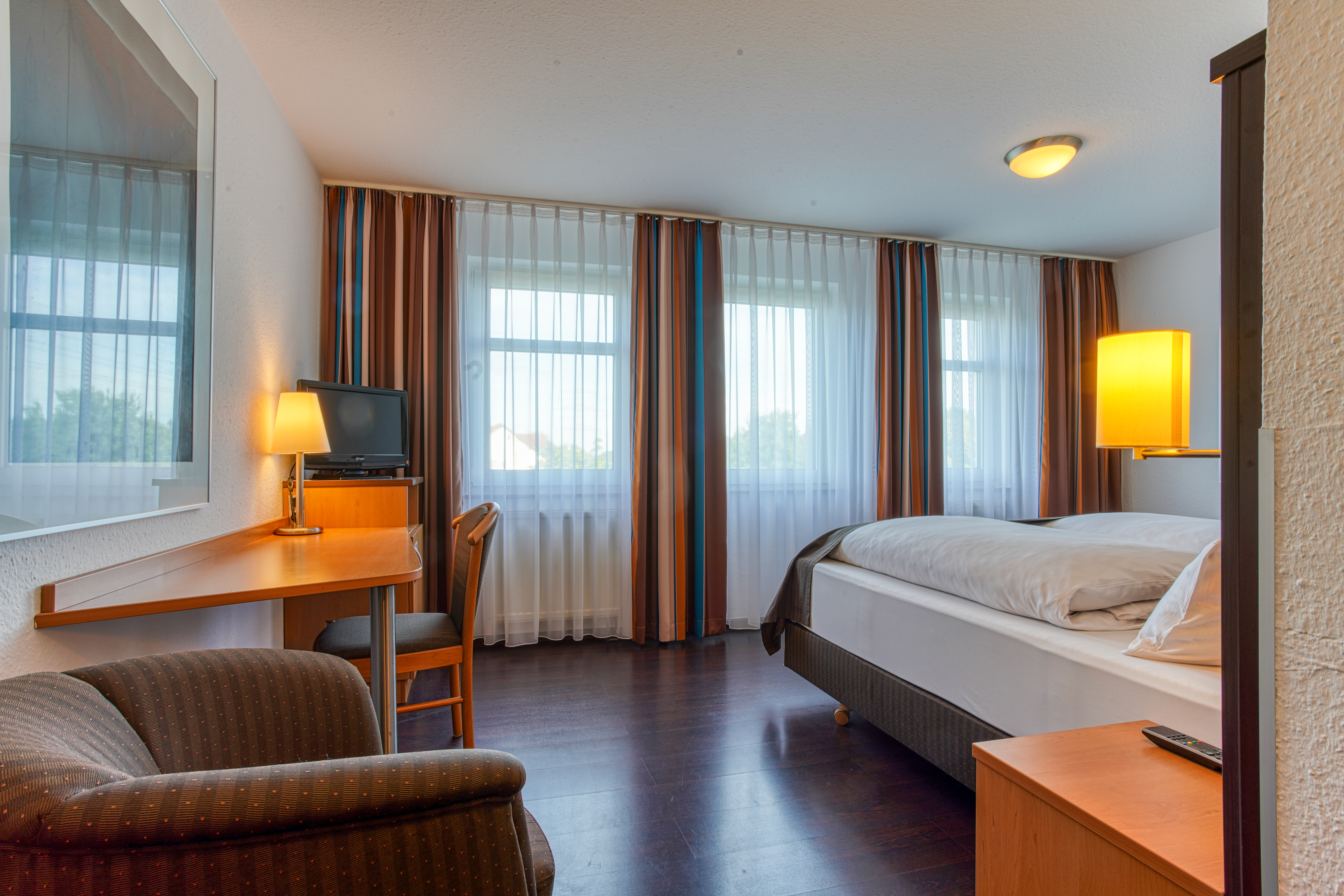 Guest room at the Centro Hotel U-NO1, Trademark Collection by Wyndham in Grossbettlingen, Other than US/Canada