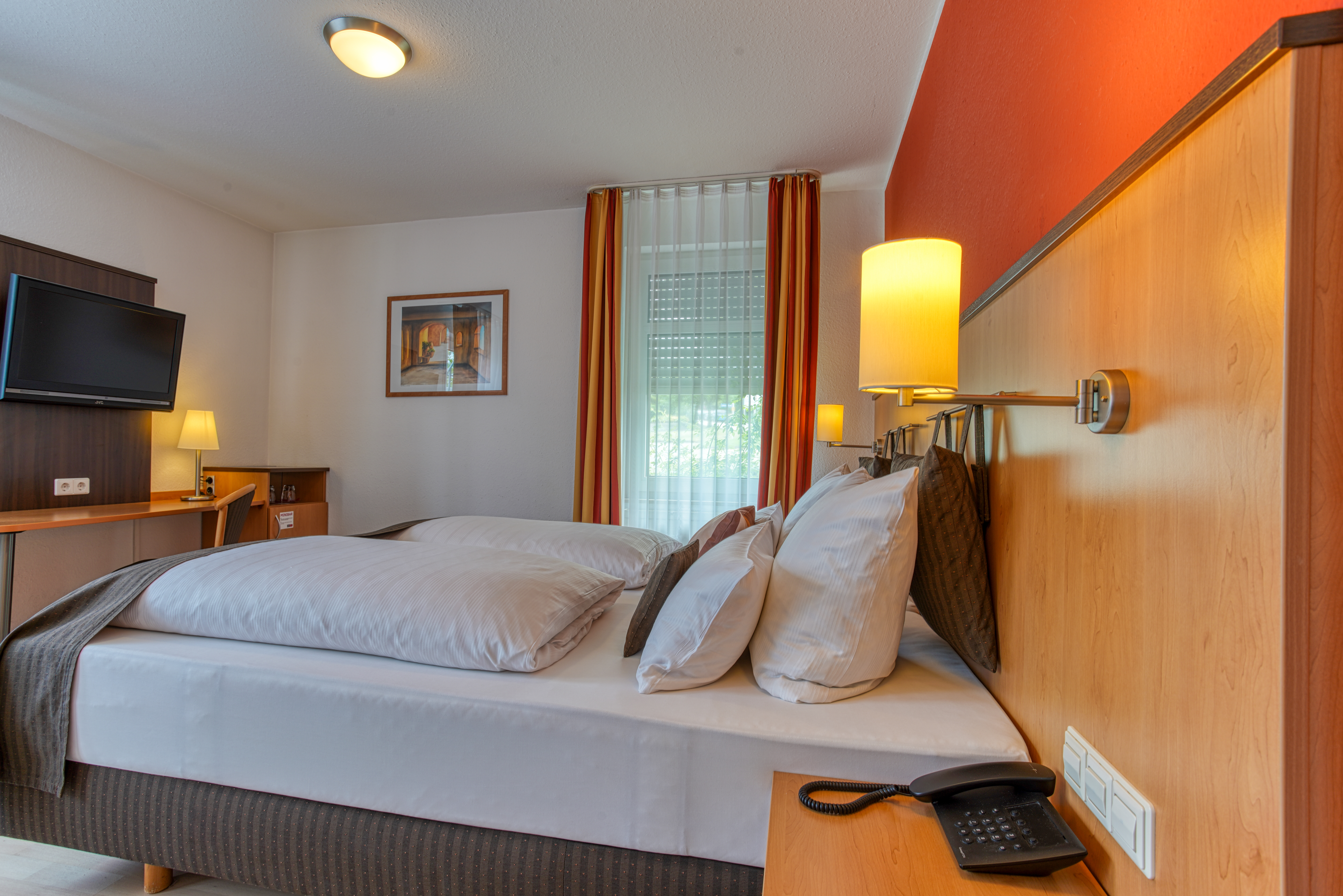 Guest room at the Centro Hotel U-NO1, Trademark Collection by Wyndham in Grossbettlingen, Other than US/Canada
