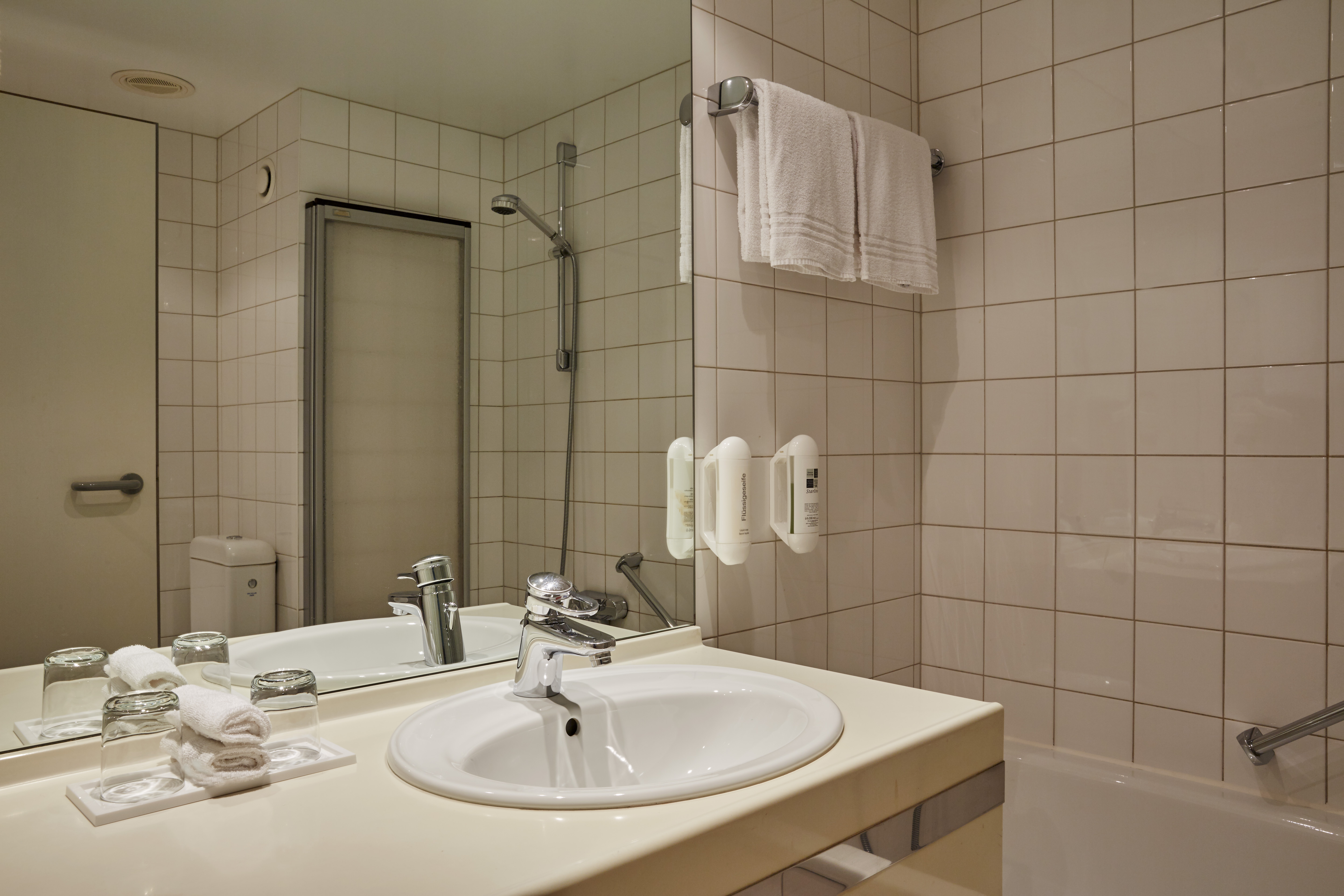 Guest room bath at the H+ Hotel Leipzig-Halle in Landsberg, Other than US/Canada