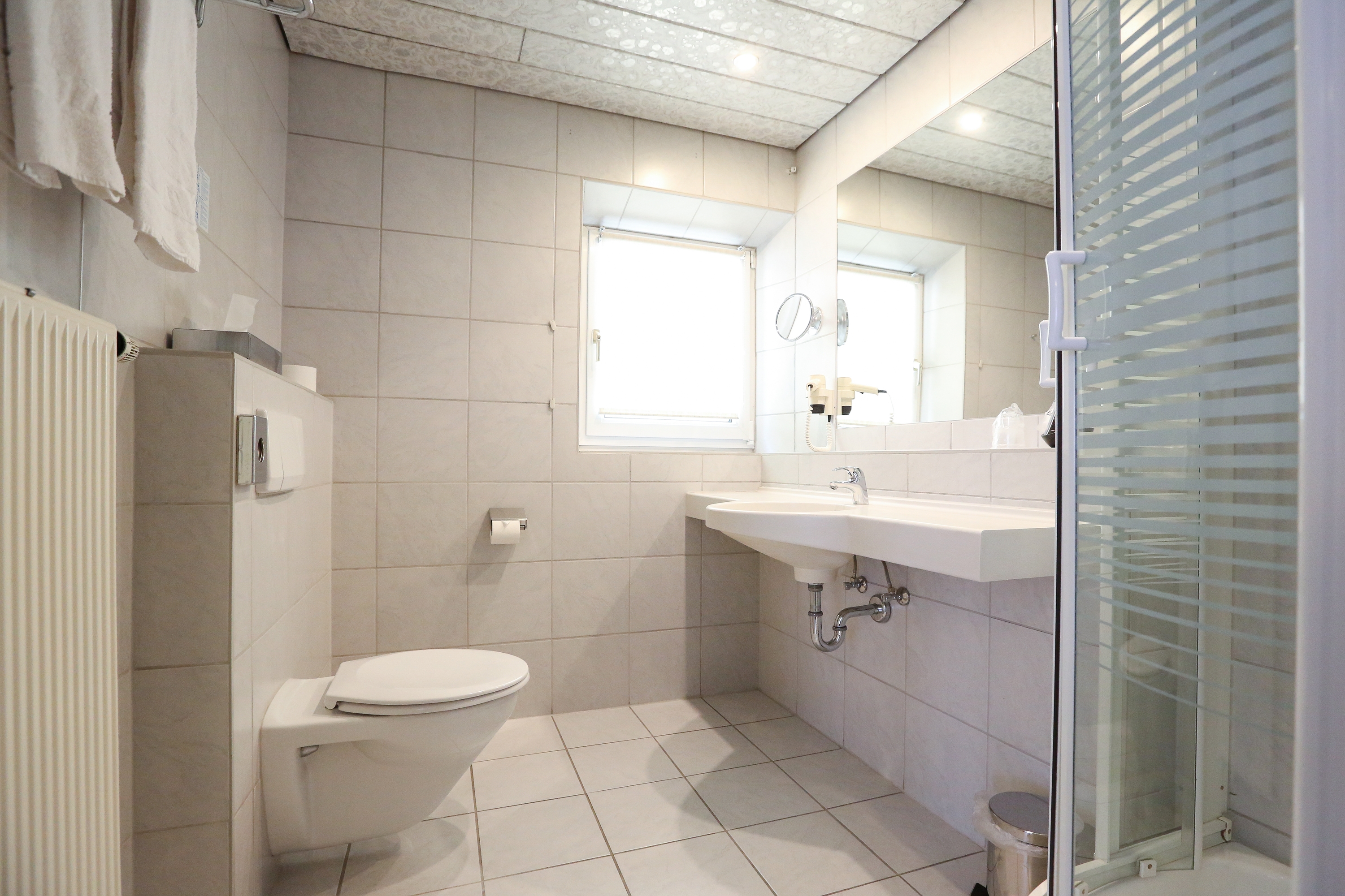 Guest room bath at the Arthotel ANA Goggl, Trademark Collection by Wyndham in Landsberg am Lech, Other than US/Canada