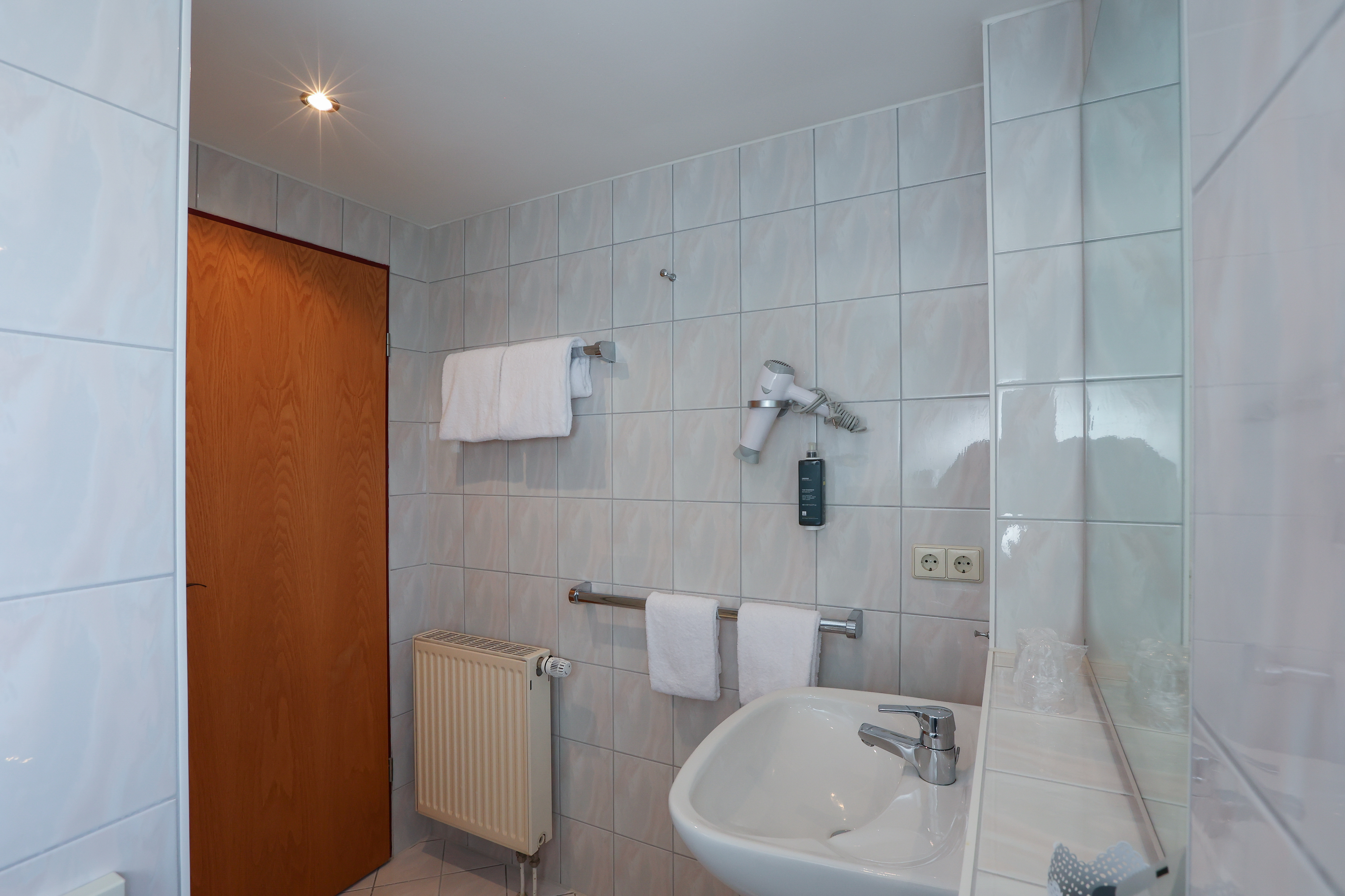 Guest room bath at the ANA Panorama, Trademark Collection by Wyndham in Marktoberdorf, Other than US/Canada