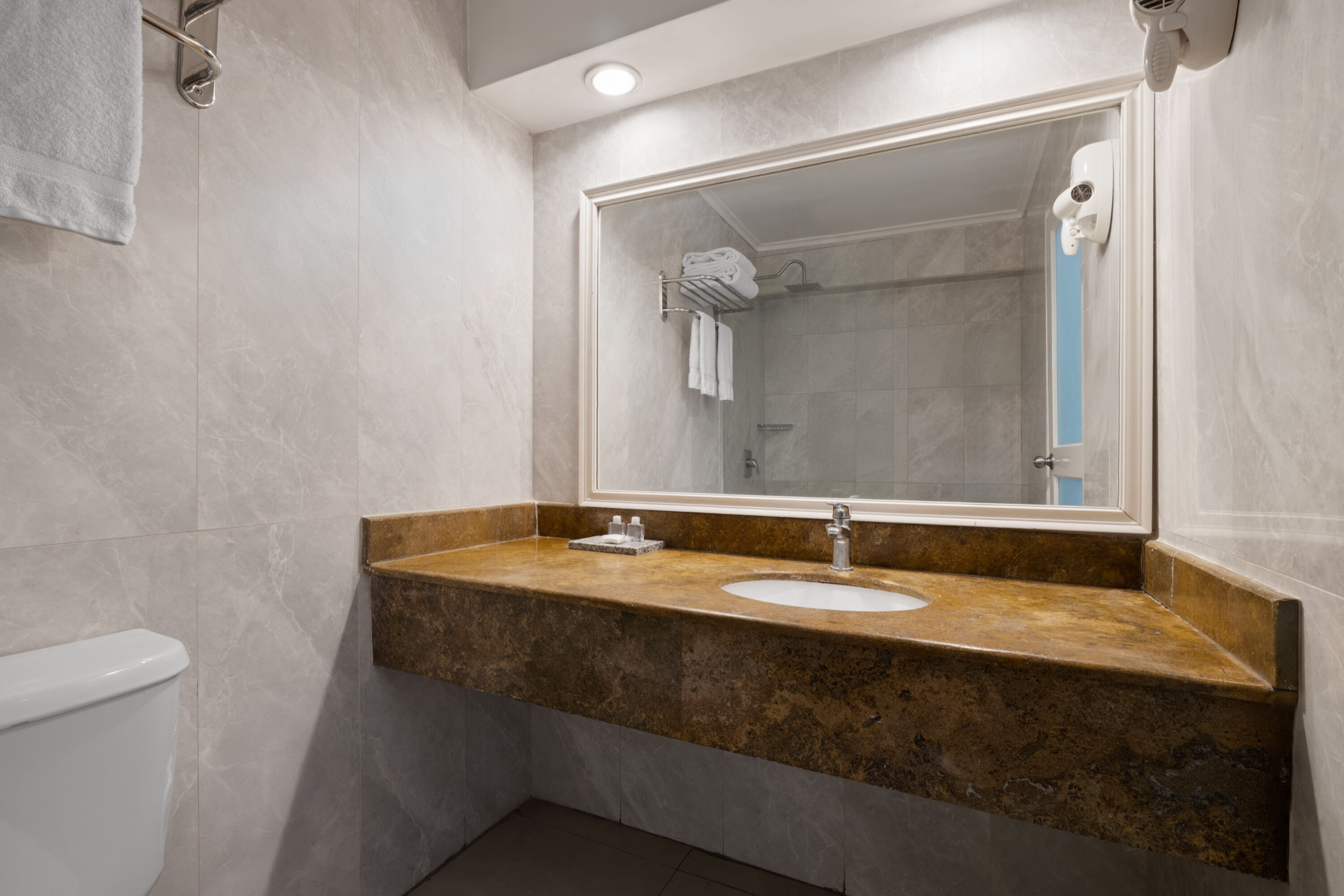 Guest room bath at the Grand Decameron Montego Beach, A Trademark All Inclusive in Montego Bay, Other than US/Canada