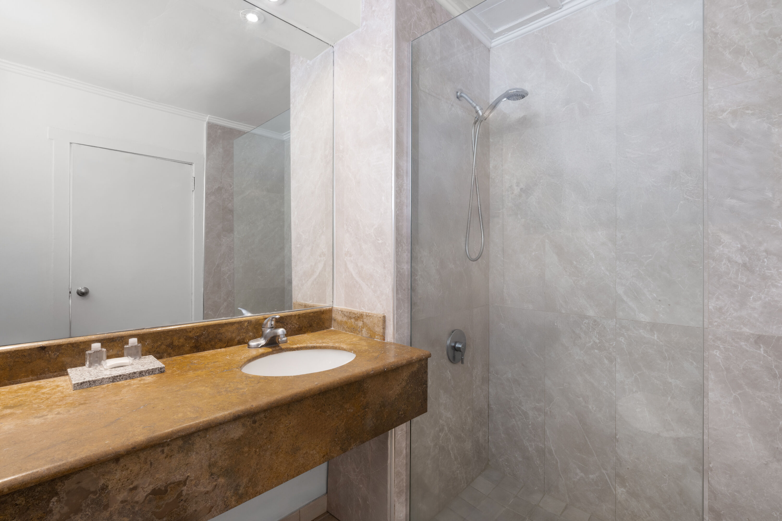 Guest room bath at the Grand Decameron Montego Beach, A Trademark All Inclusive in Montego Bay, Other than US/Canada