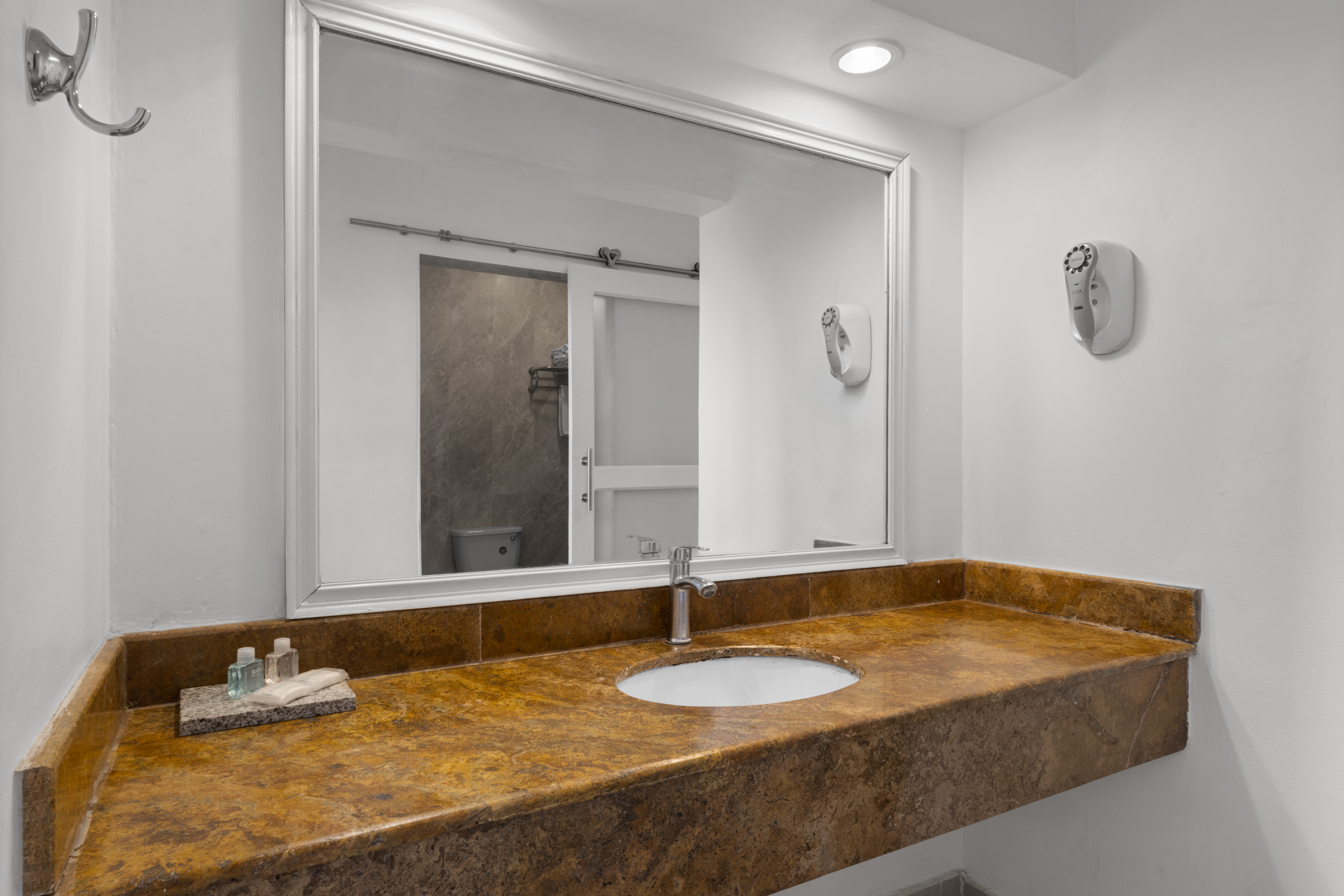 Guest room bath at the Grand Decameron Montego Beach, A Trademark All Inclusive in Montego Bay, Other than US/Canada