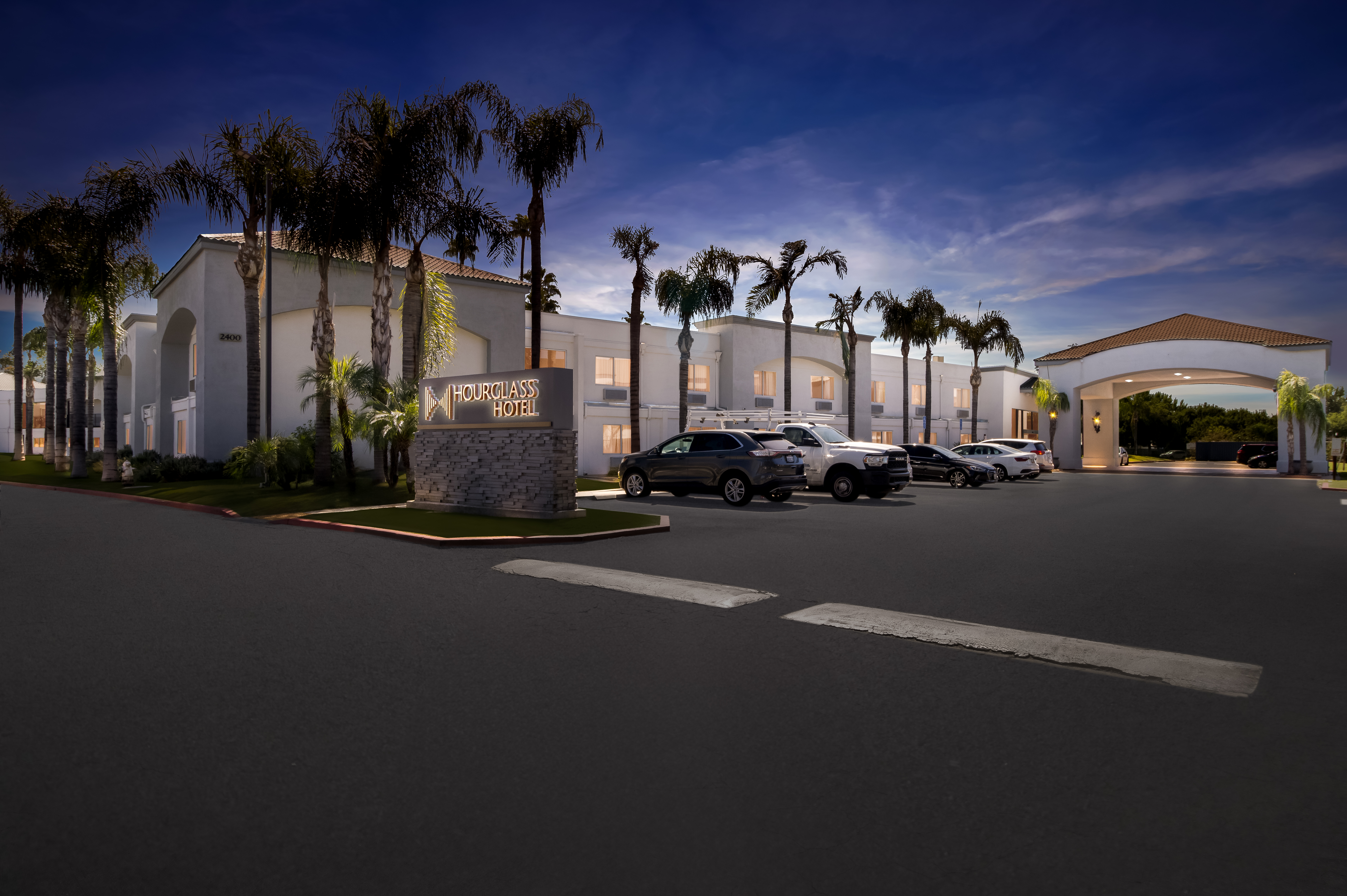 Exterior Night Image of Hourglass Hotel, Trademark Collection by Wyndham hotel in Bakersfield, California