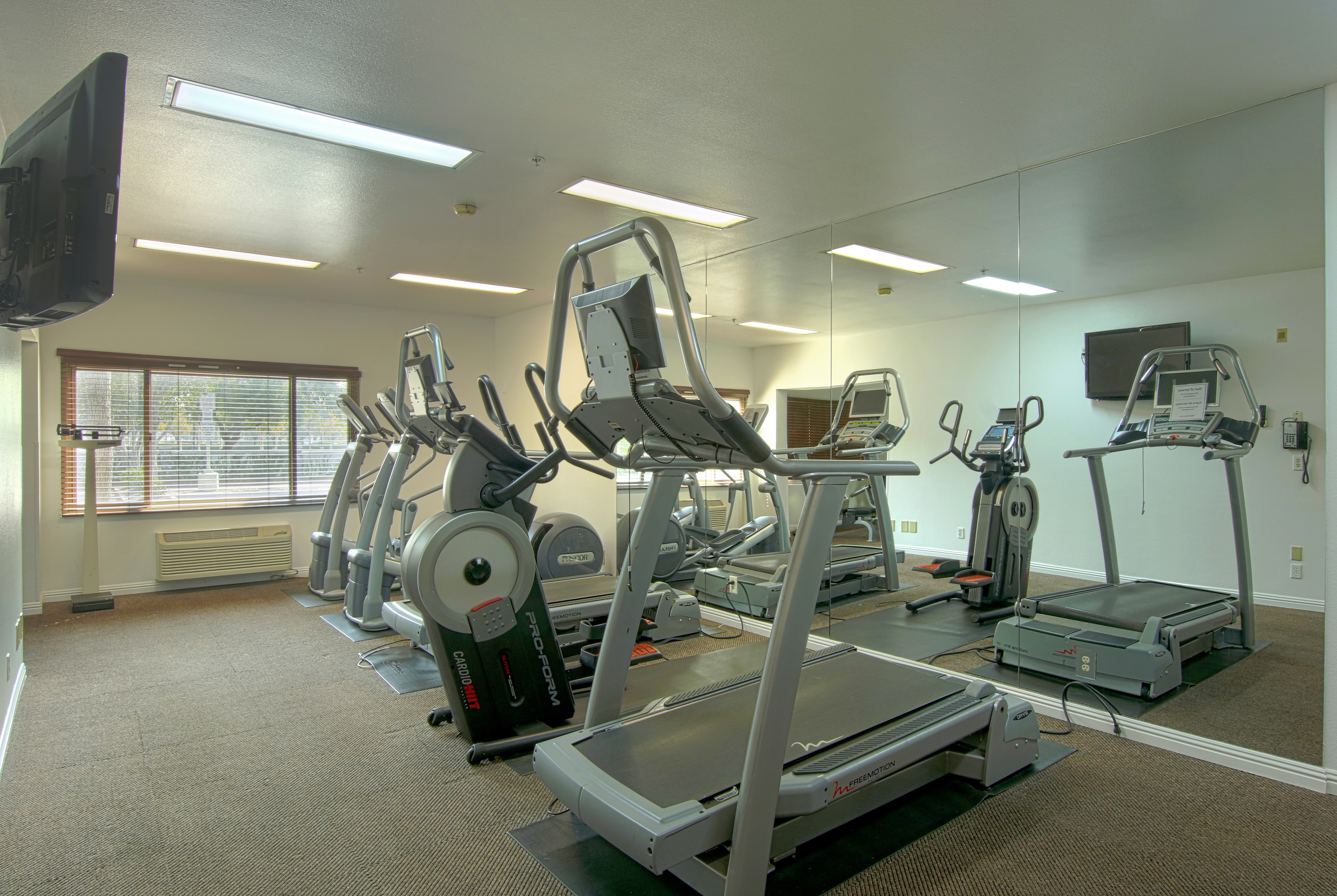Fitness room at Azure Hotel & Suites, Trademark Collection by Wyndham in Ontario, California