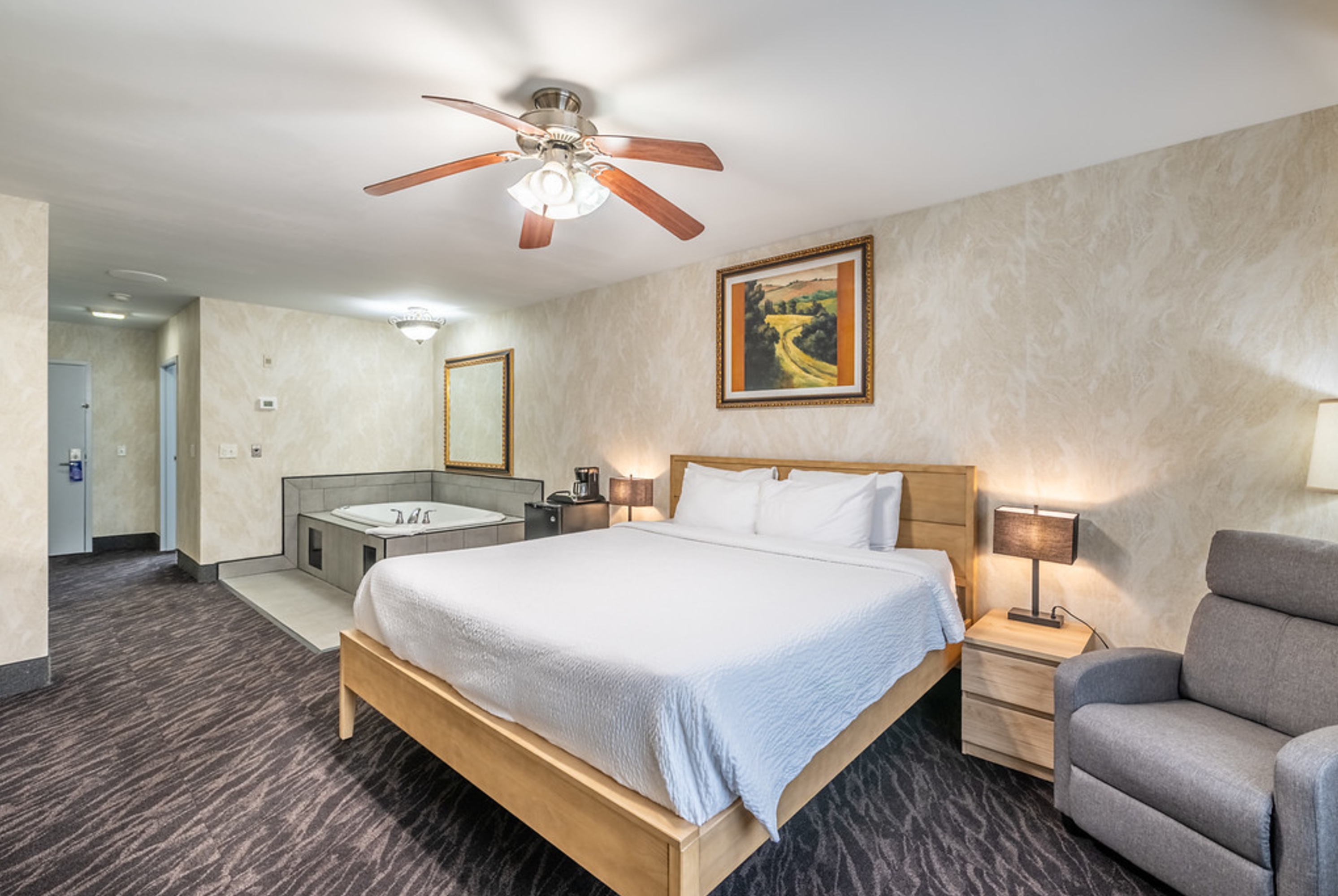 King bed guest room at the Bellissimo Hotel, Trademark by Wyndham Near Foxwoods Casino in North Stonington, Connecticut