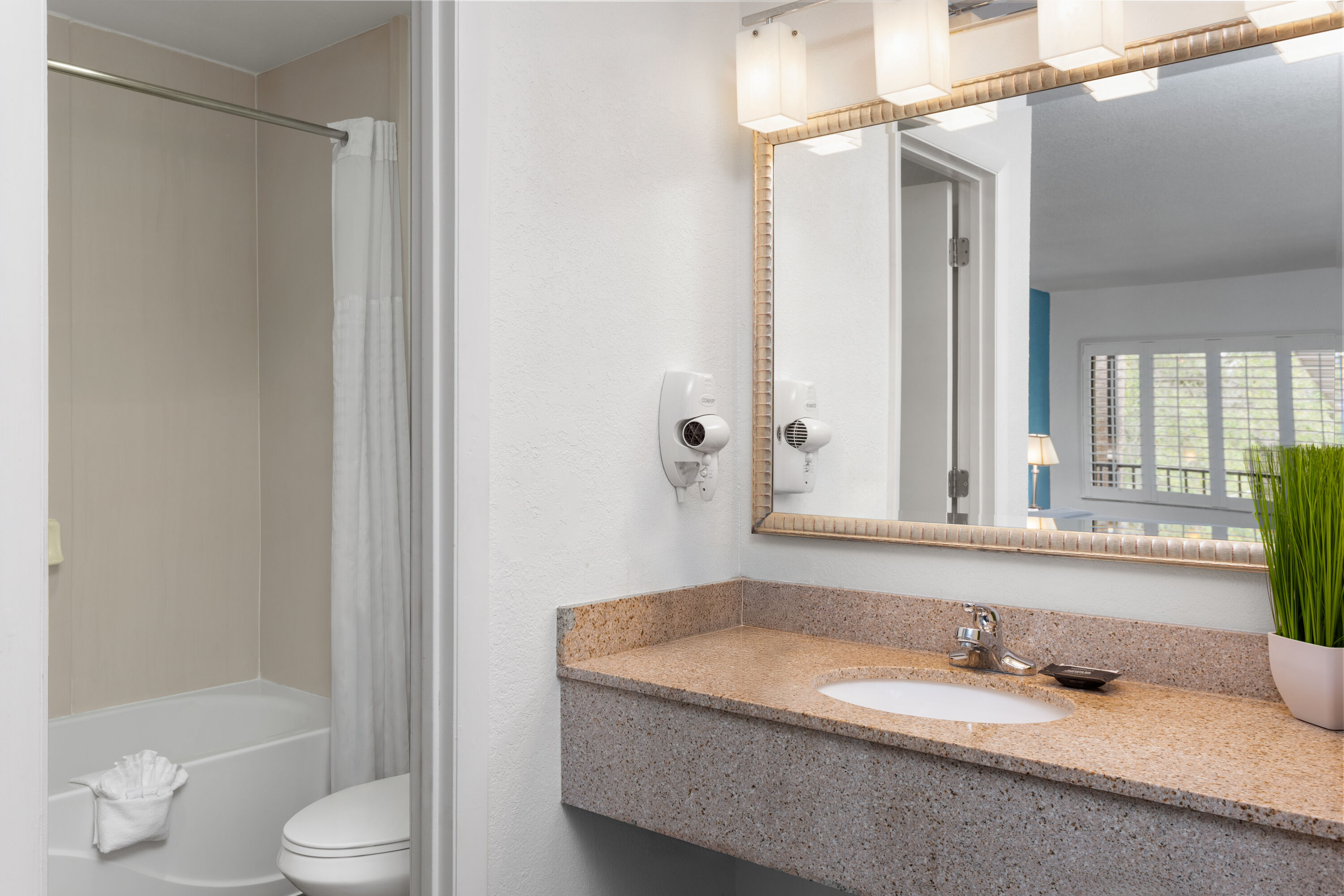 Guest room bath at the PaddleTail Waterfront Lodge, Trademark Collection by Wyndham in Crystal River, Florida