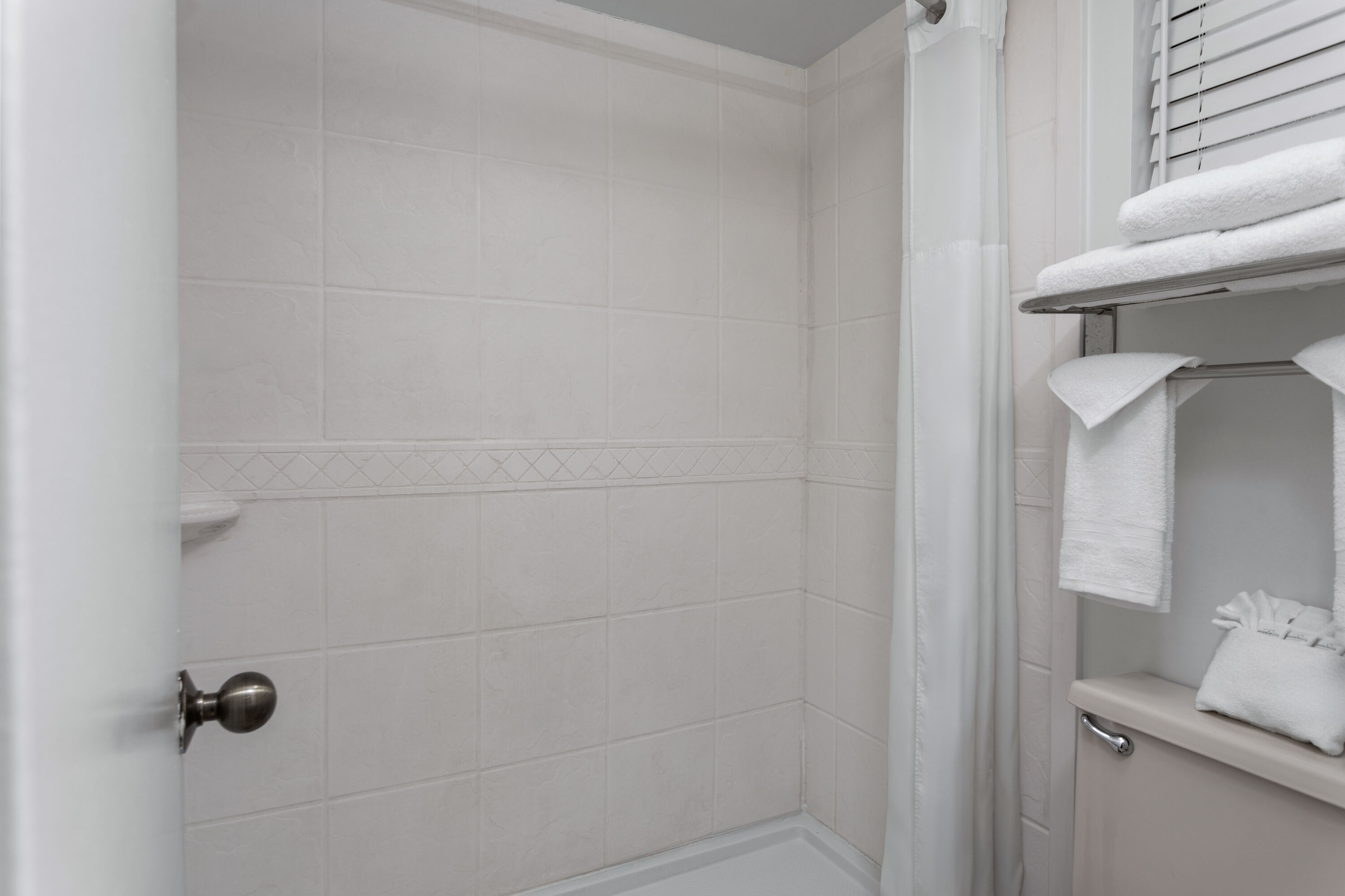 Guest room bath at the PaddleTail Waterfront Lodge, Trademark Collection by Wyndham in Crystal River, Florida