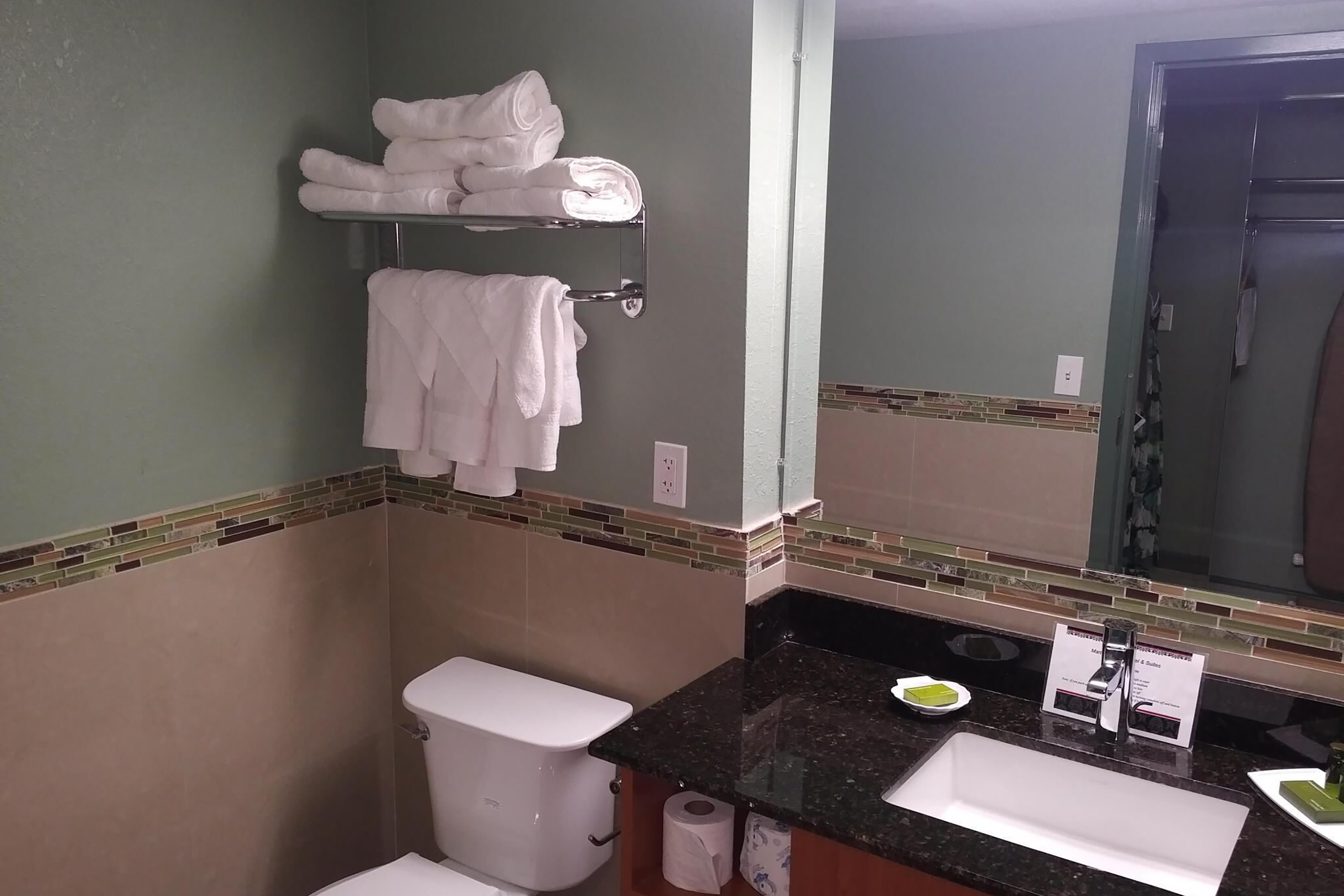 Guest room bath at the Marble Waters Hotel & Suites, Trademark by Wyndham in Jacksonville, Florida