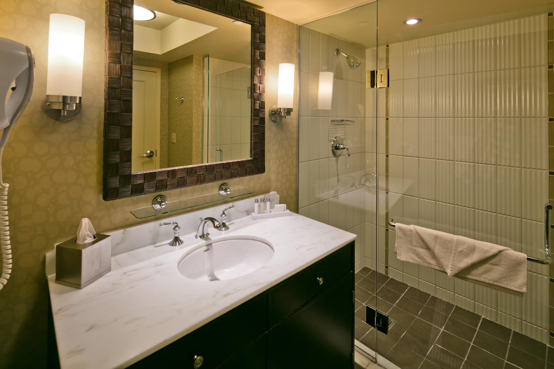Guest room bath at the Isle Casino Hotel Bettendorf Trademark Collection by Wyndham in Bettendorf, Iowa