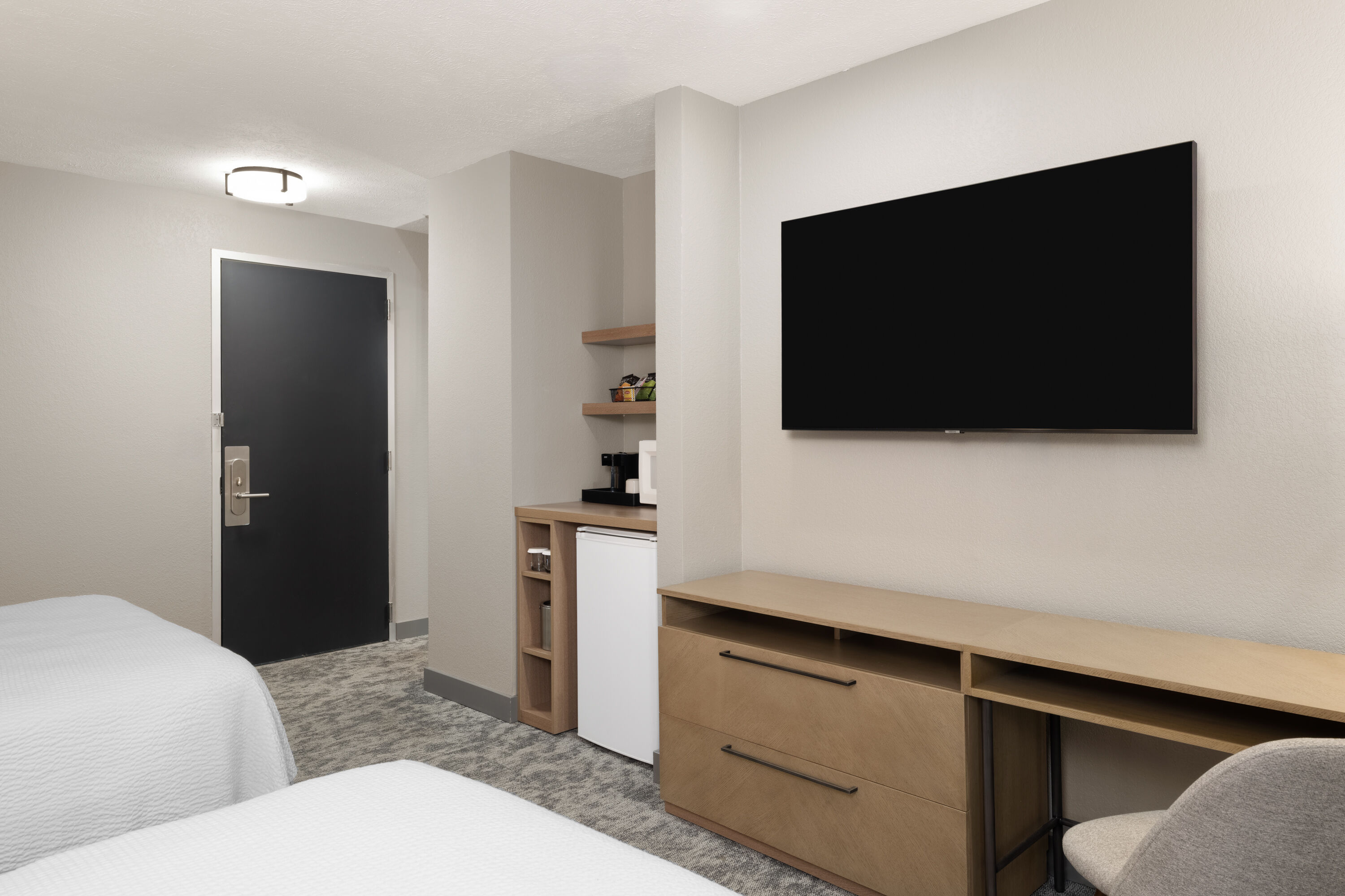 Guest room at the Eastland Suites Hotel & Conference Ctr, Trademark by Wyndham in Bloomington, Illinois