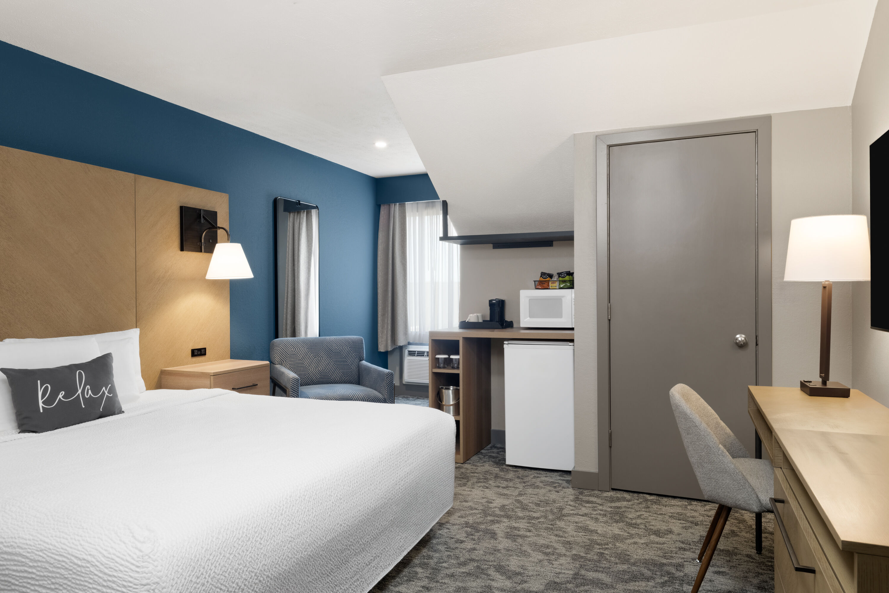 Guest room at the Eastland Suites Hotel & Conference Ctr, Trademark by Wyndham in Bloomington, Illinois