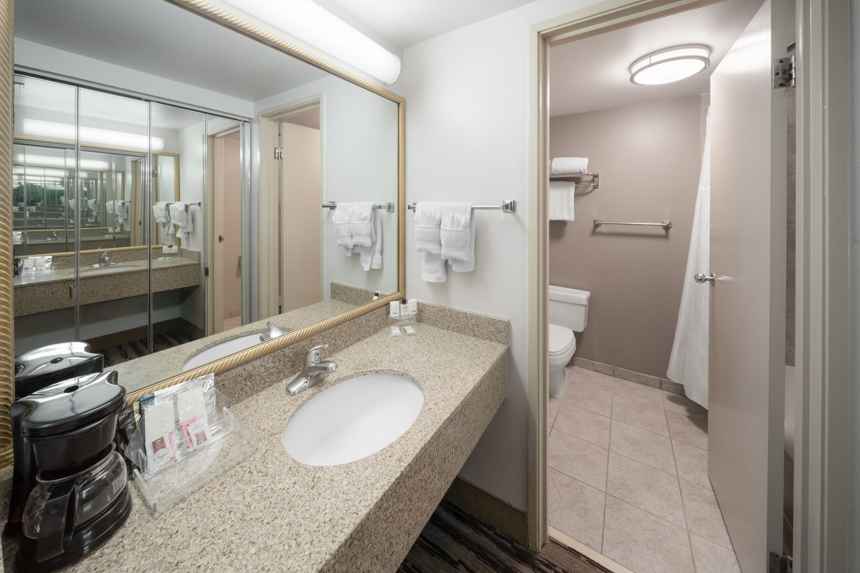 Guest room bath at the Endeavor Inn & Suites, Trademark Collection by Wyndham in Topeka, Kansas