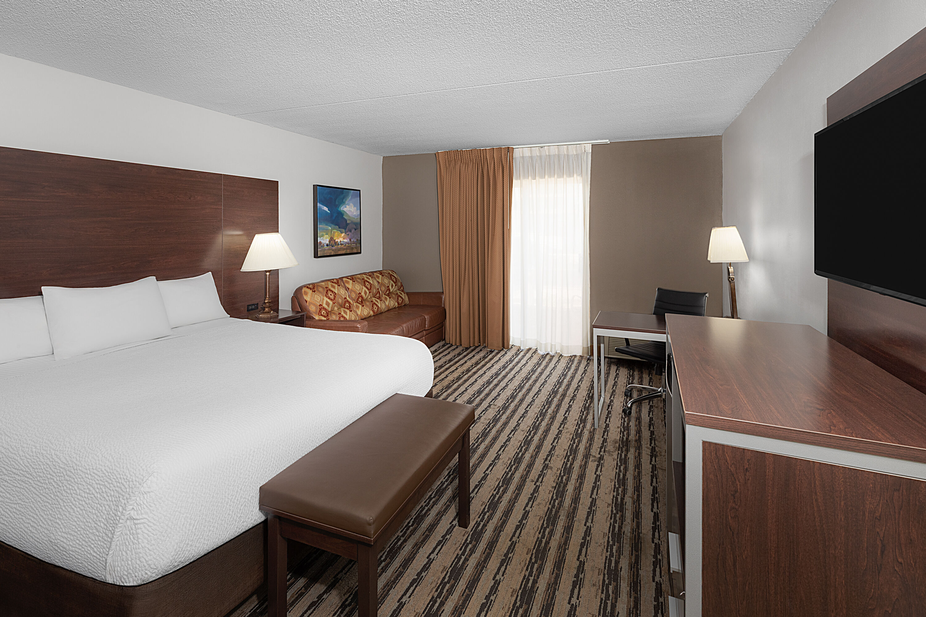 Guest room at the Endeavor Inn & Suites, Trademark Collection by Wyndham in Topeka, Kansas
