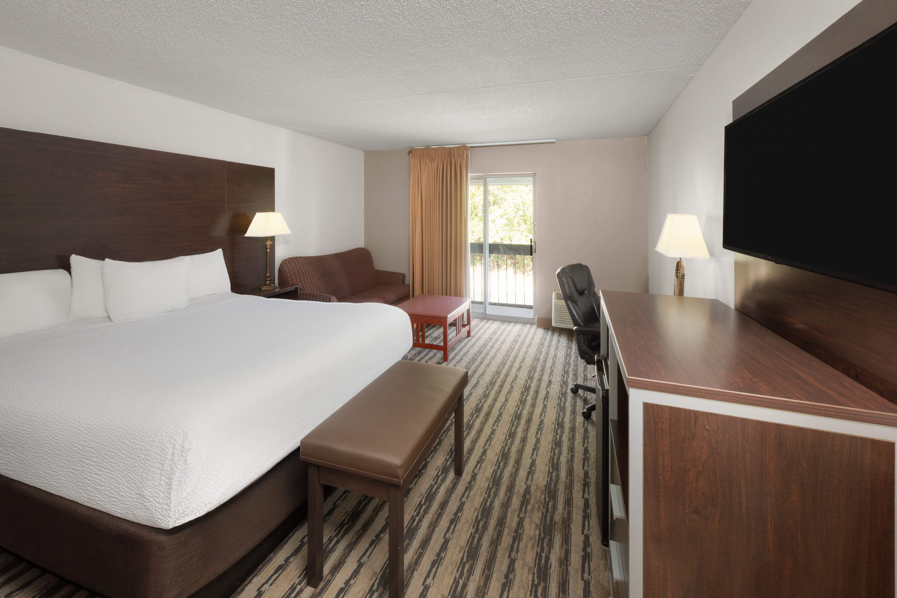 Guest room at the Endeavor Inn & Suites, Trademark Collection by Wyndham in Topeka, Kansas