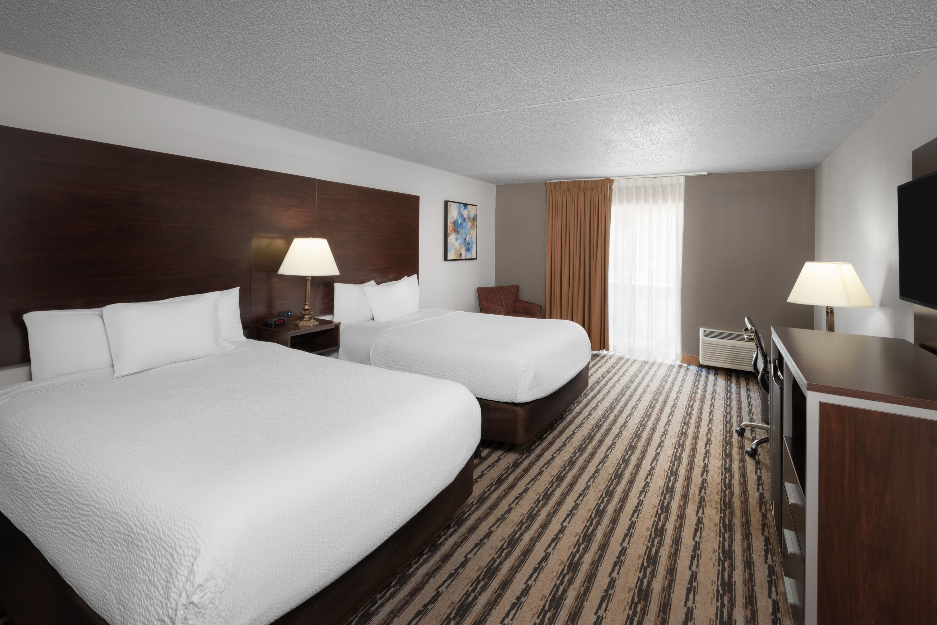 Guest room at the Endeavor Inn & Suites, Trademark Collection by Wyndham in Topeka, Kansas