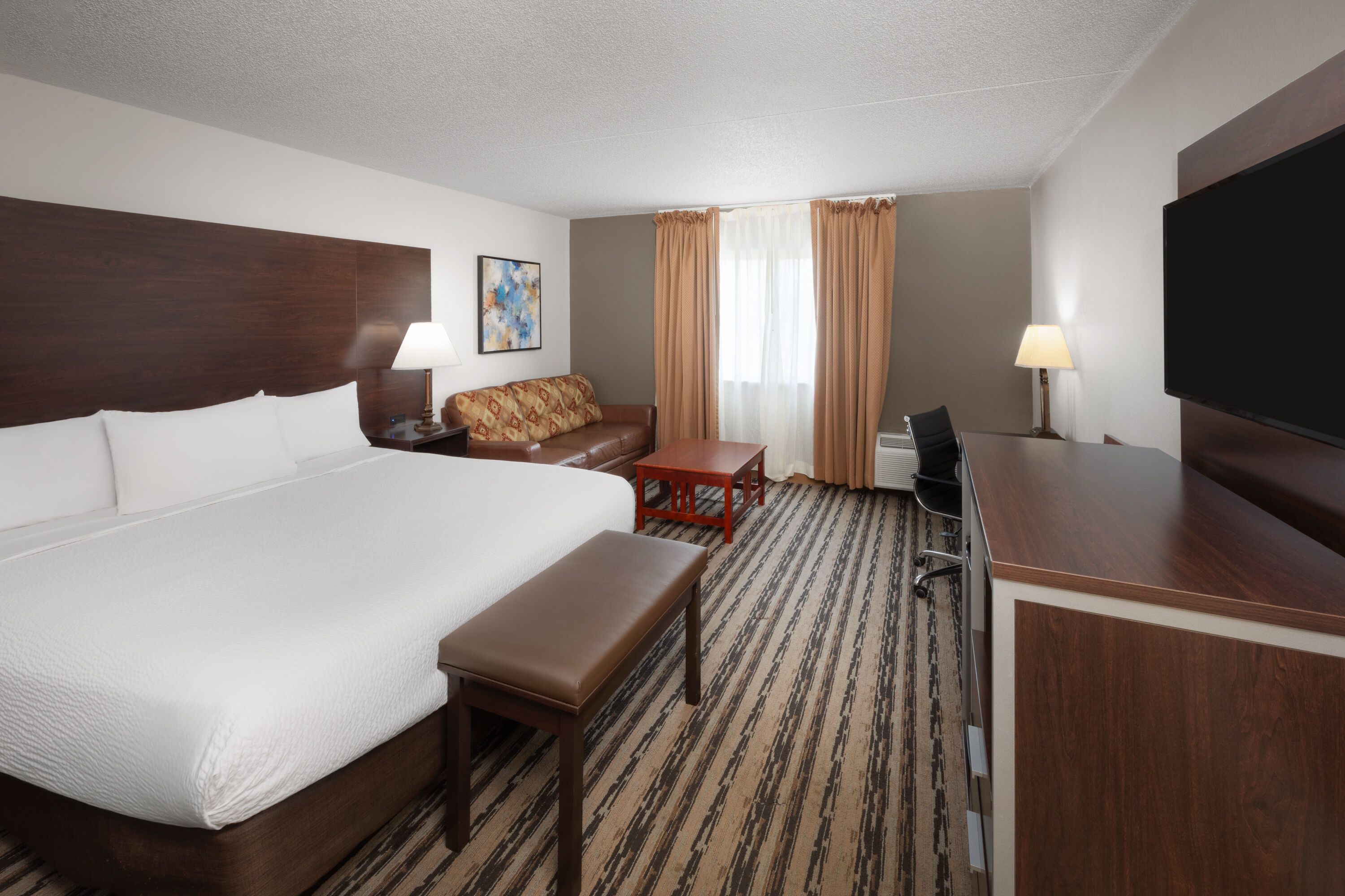 Guest room at the Endeavor Inn & Suites, Trademark Collection by Wyndham in Topeka, Kansas