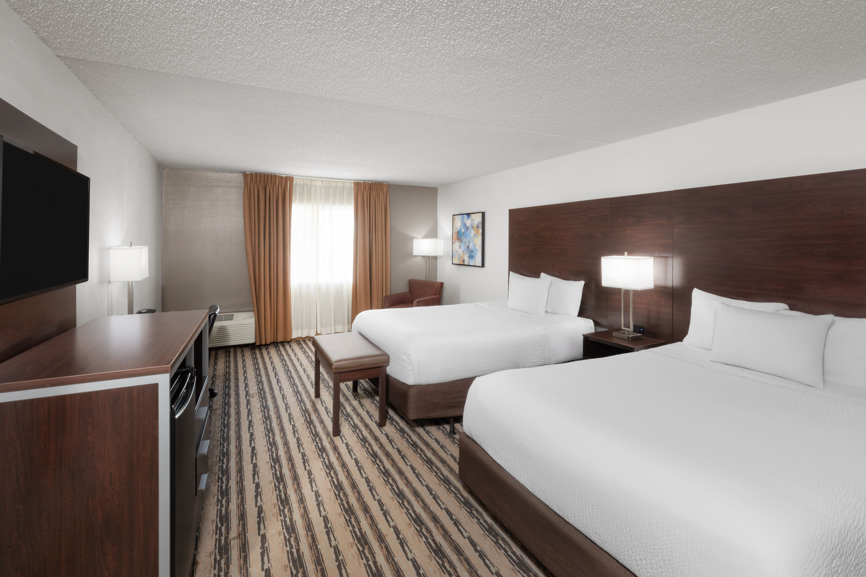 Guest room at the Endeavor Inn & Suites, Trademark Collection by Wyndham in Topeka, Kansas