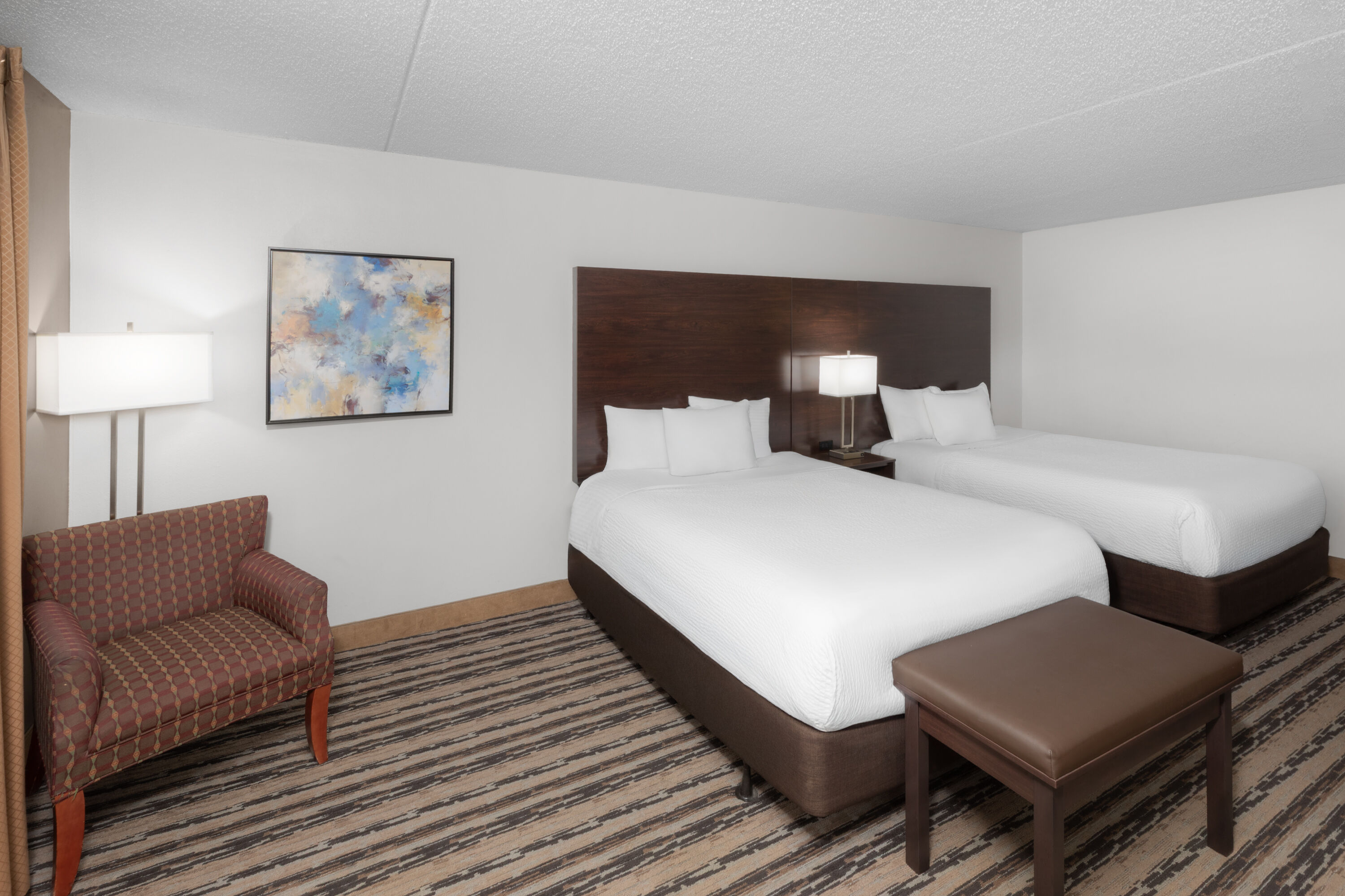 Guest room at the Endeavor Inn & Suites, Trademark Collection by Wyndham in Topeka, Kansas